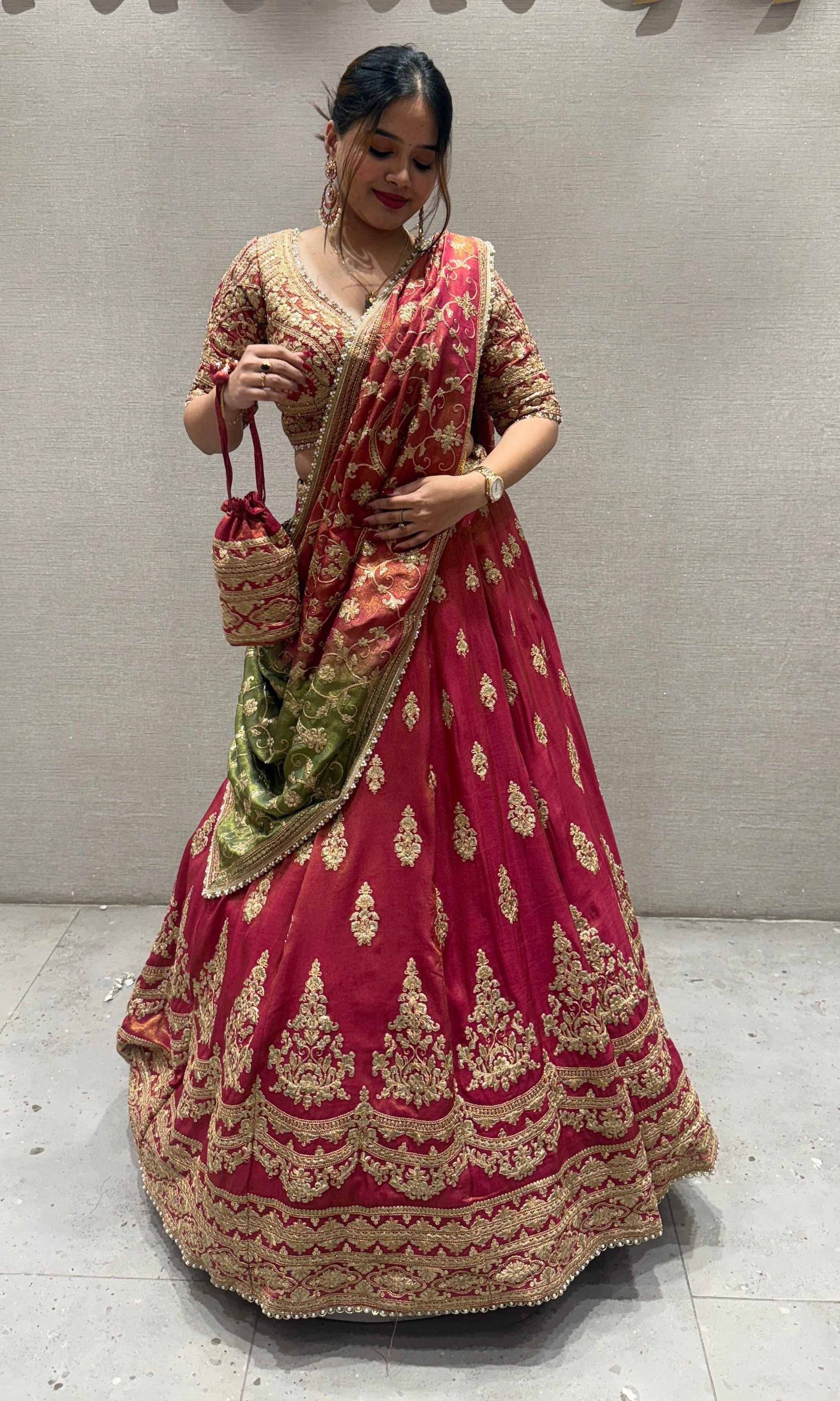 Brick red and green Lehenga with potli