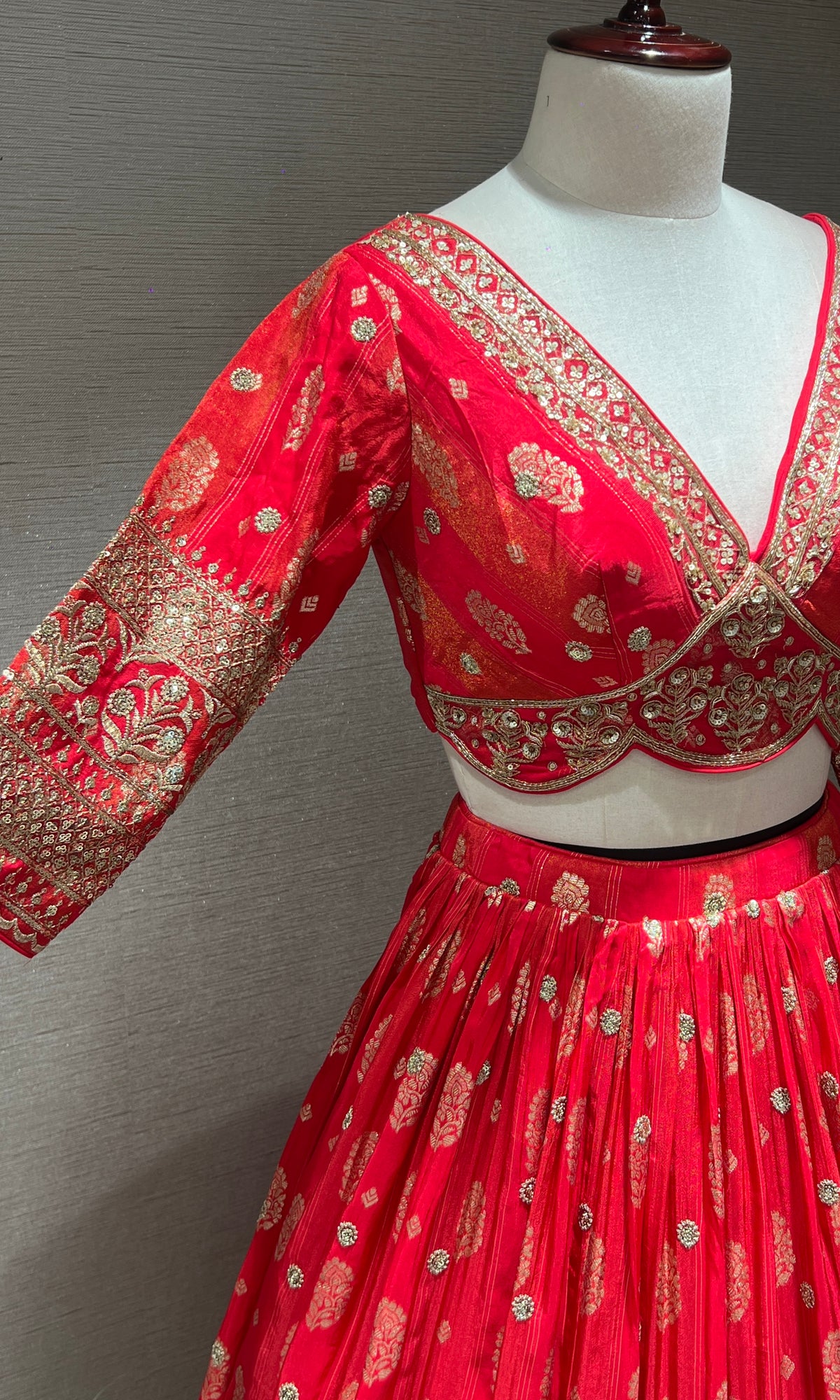 pink lehenga with intricate gold detailing