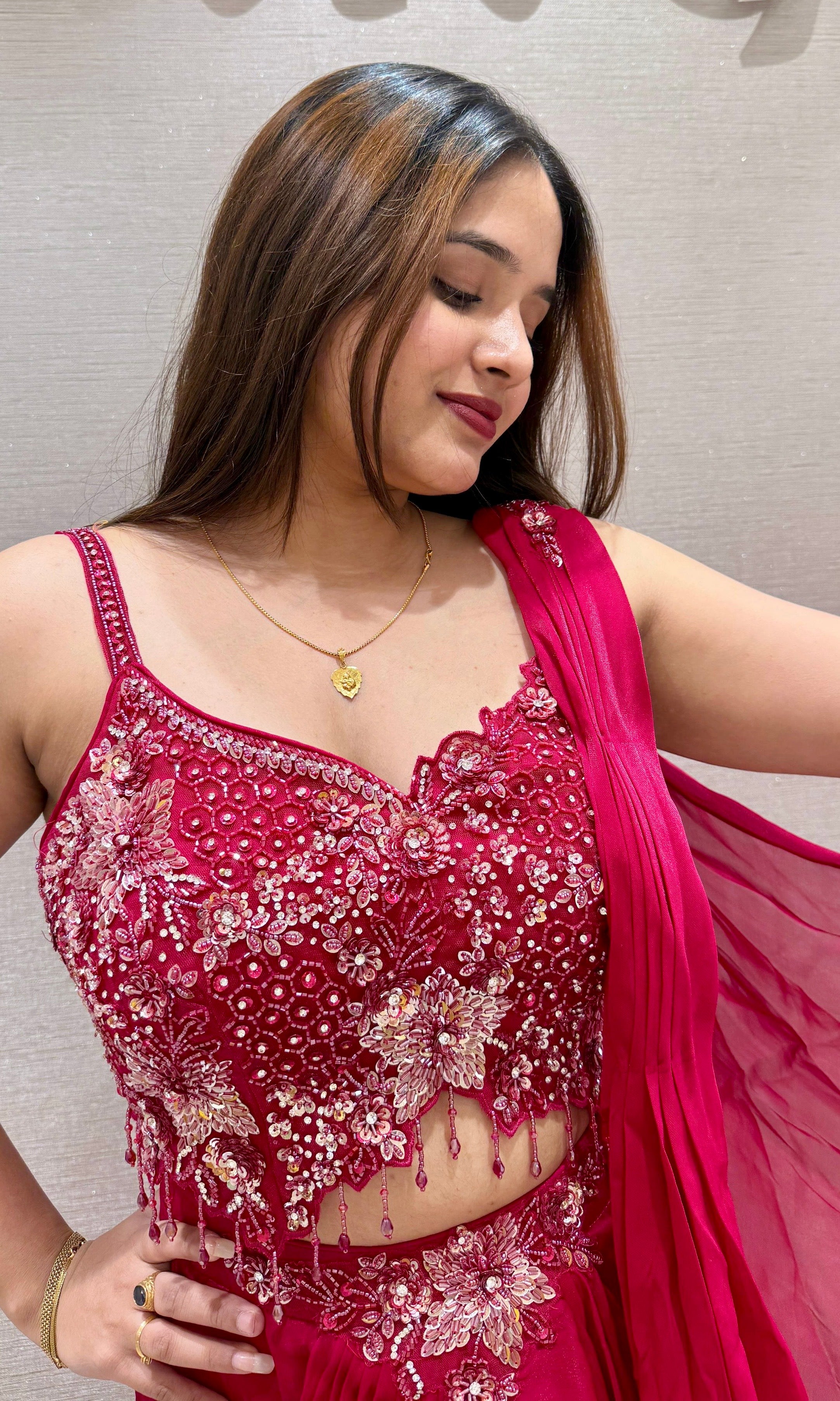 Red drape saree with embellished blouse