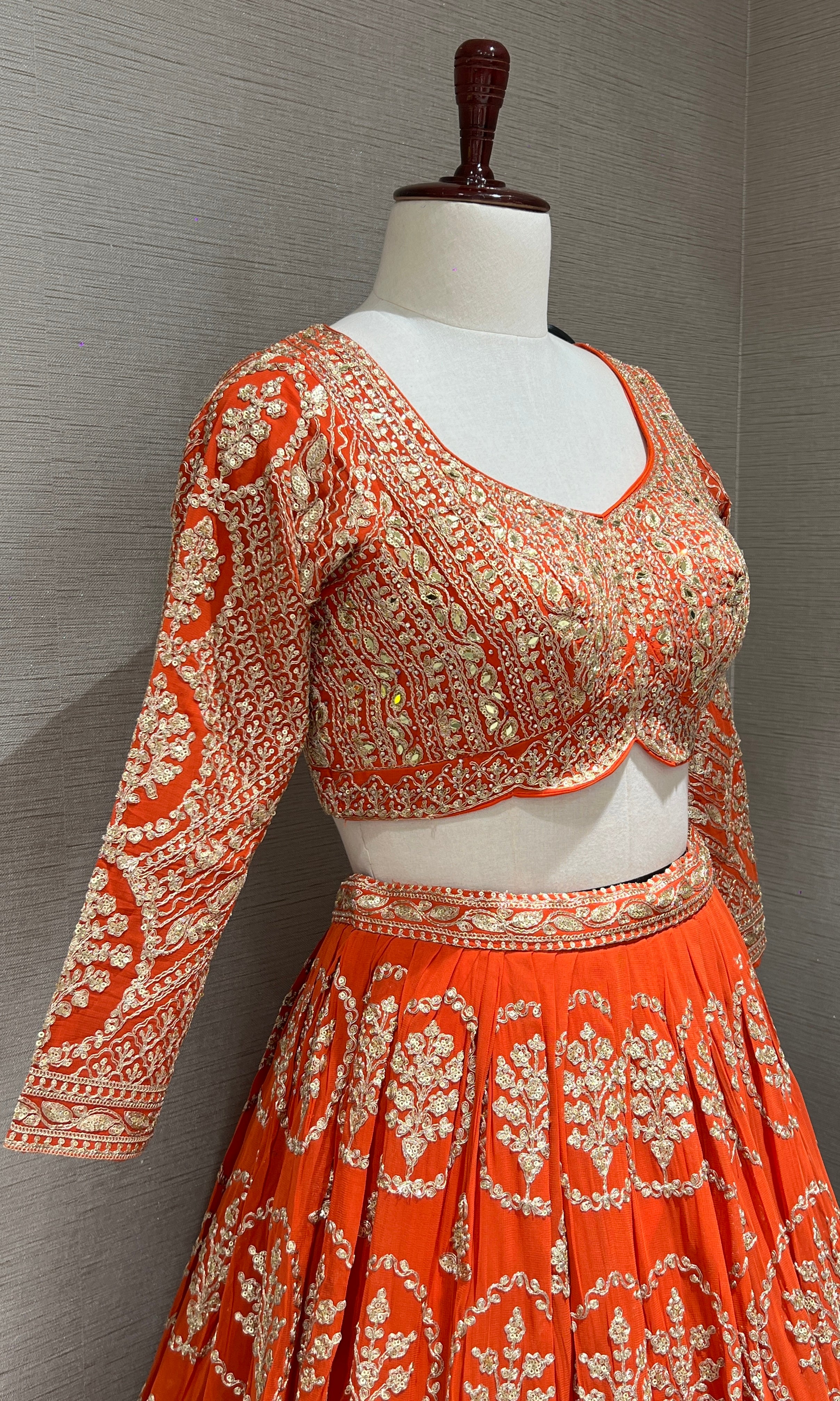Orange Lehenga with zari and sequin gold embroidery