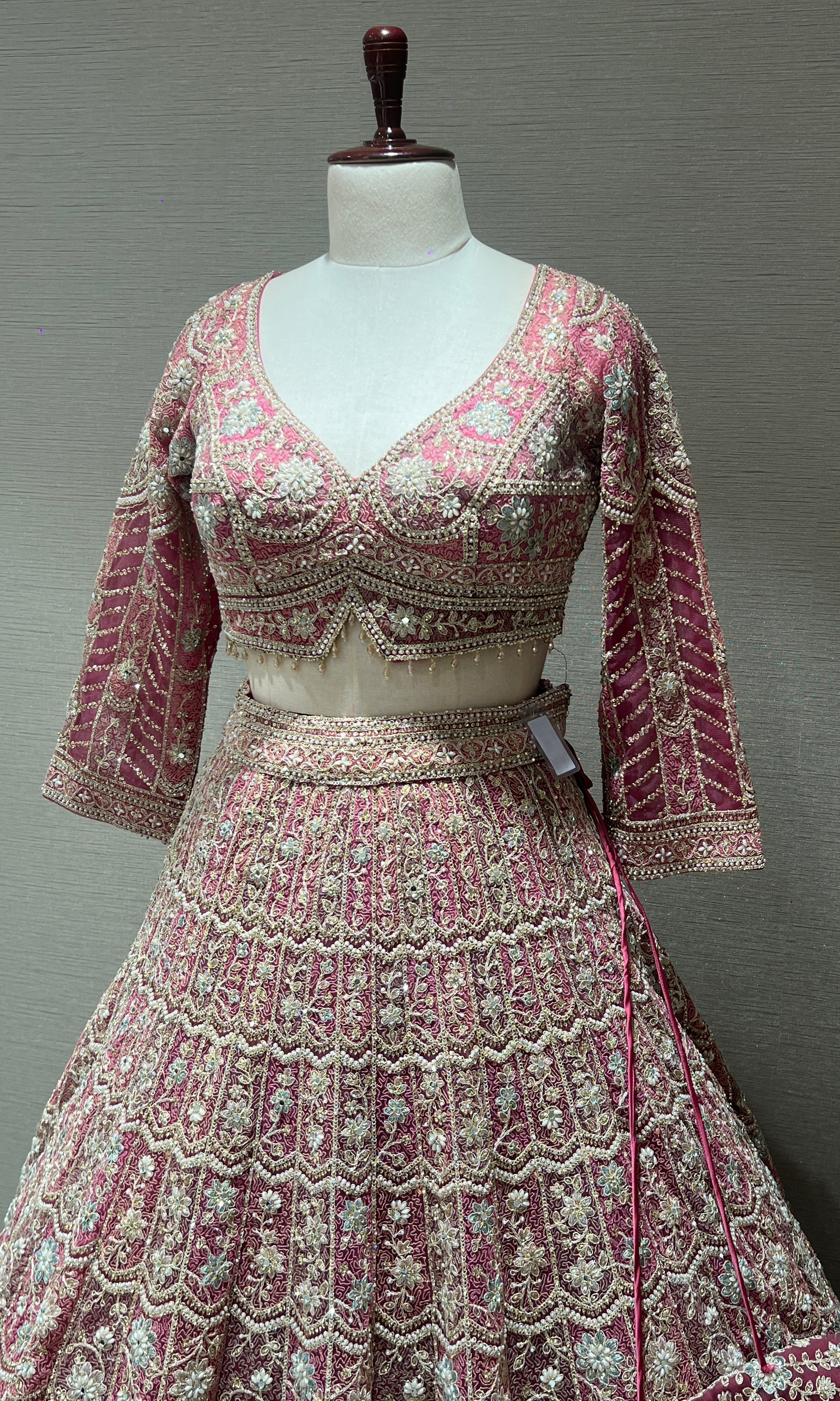 Pink lehenga with intricate embroidery and zari work