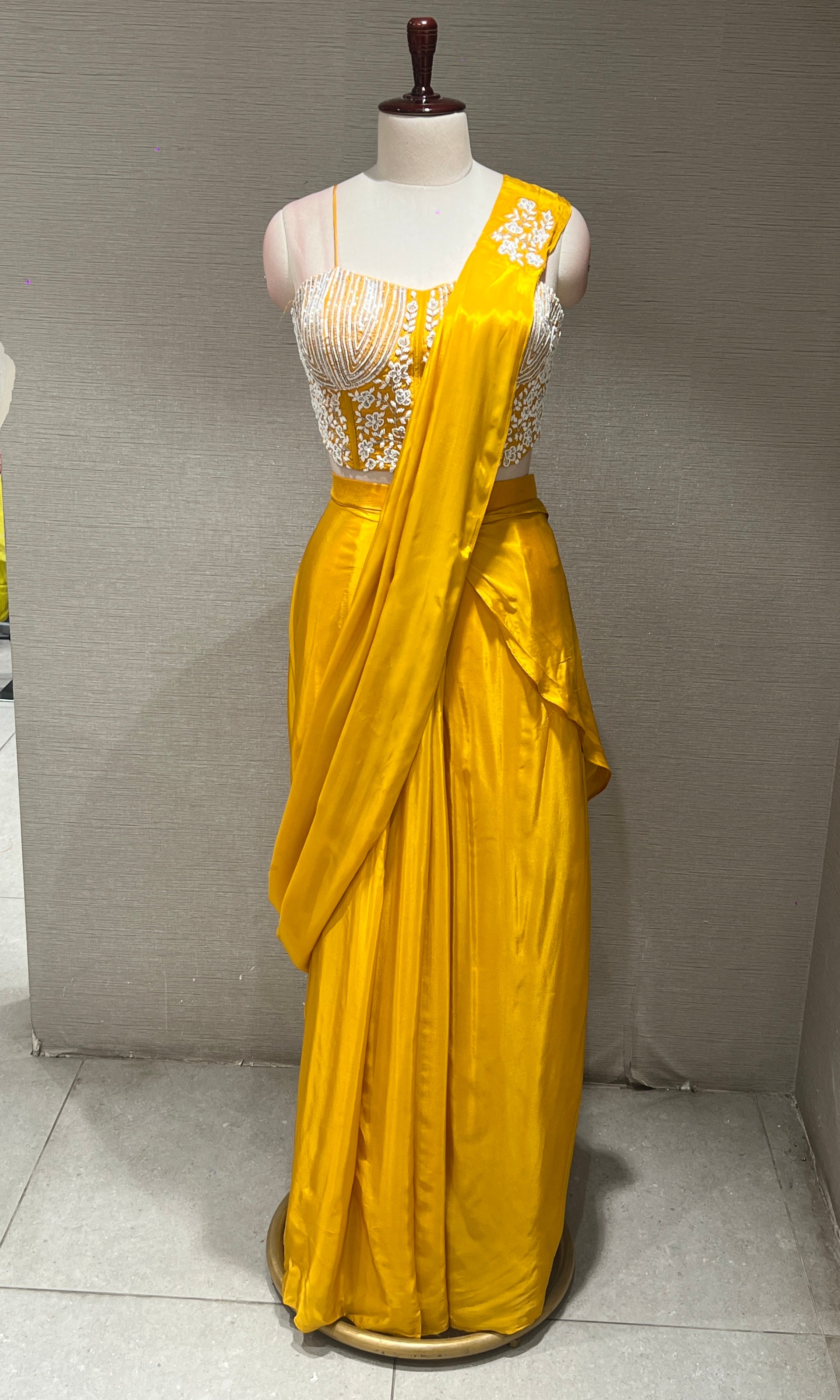 Yellow drape saree with Corset blouse