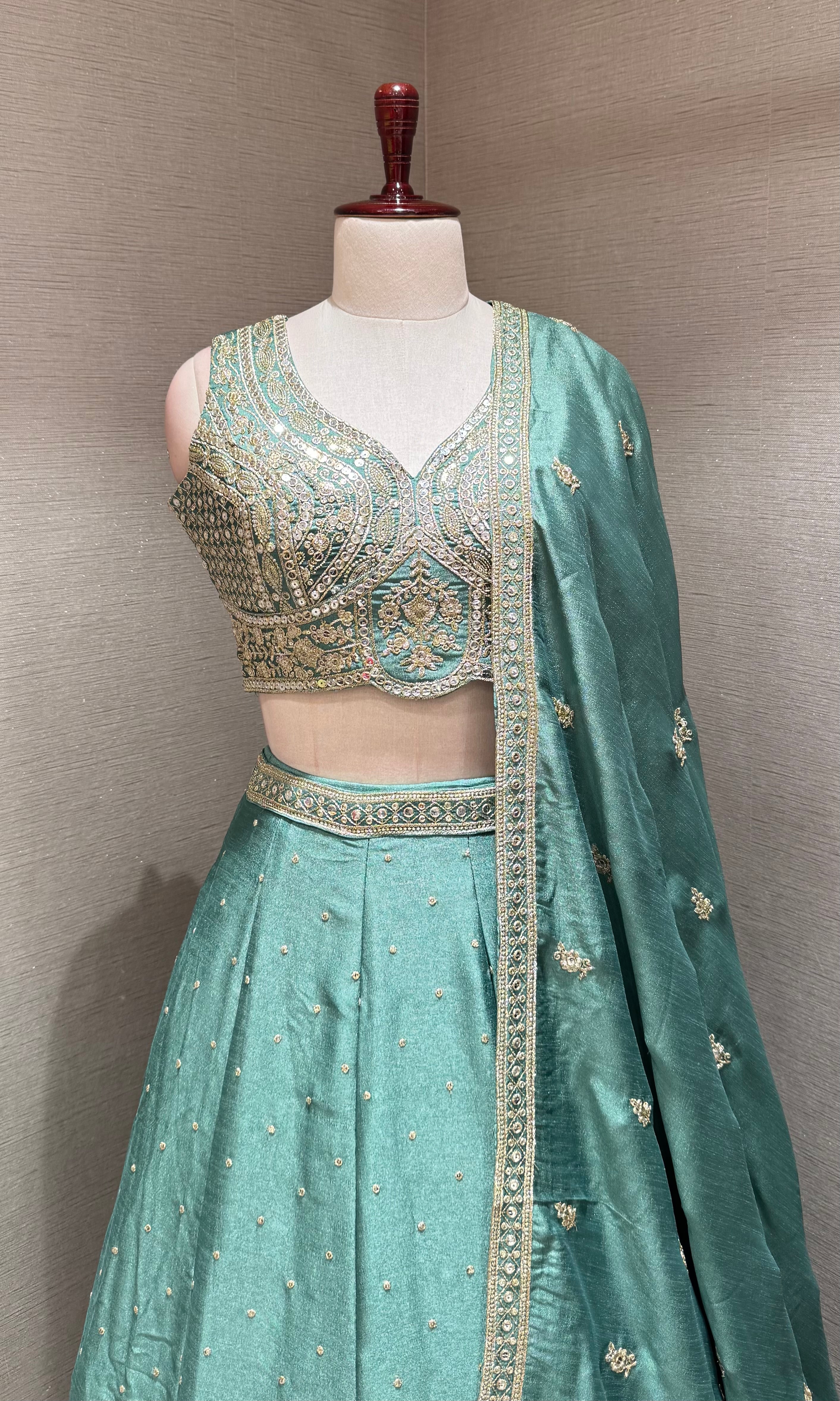 Green Flared Lehenga Choli with Heavy Gold Embroidery