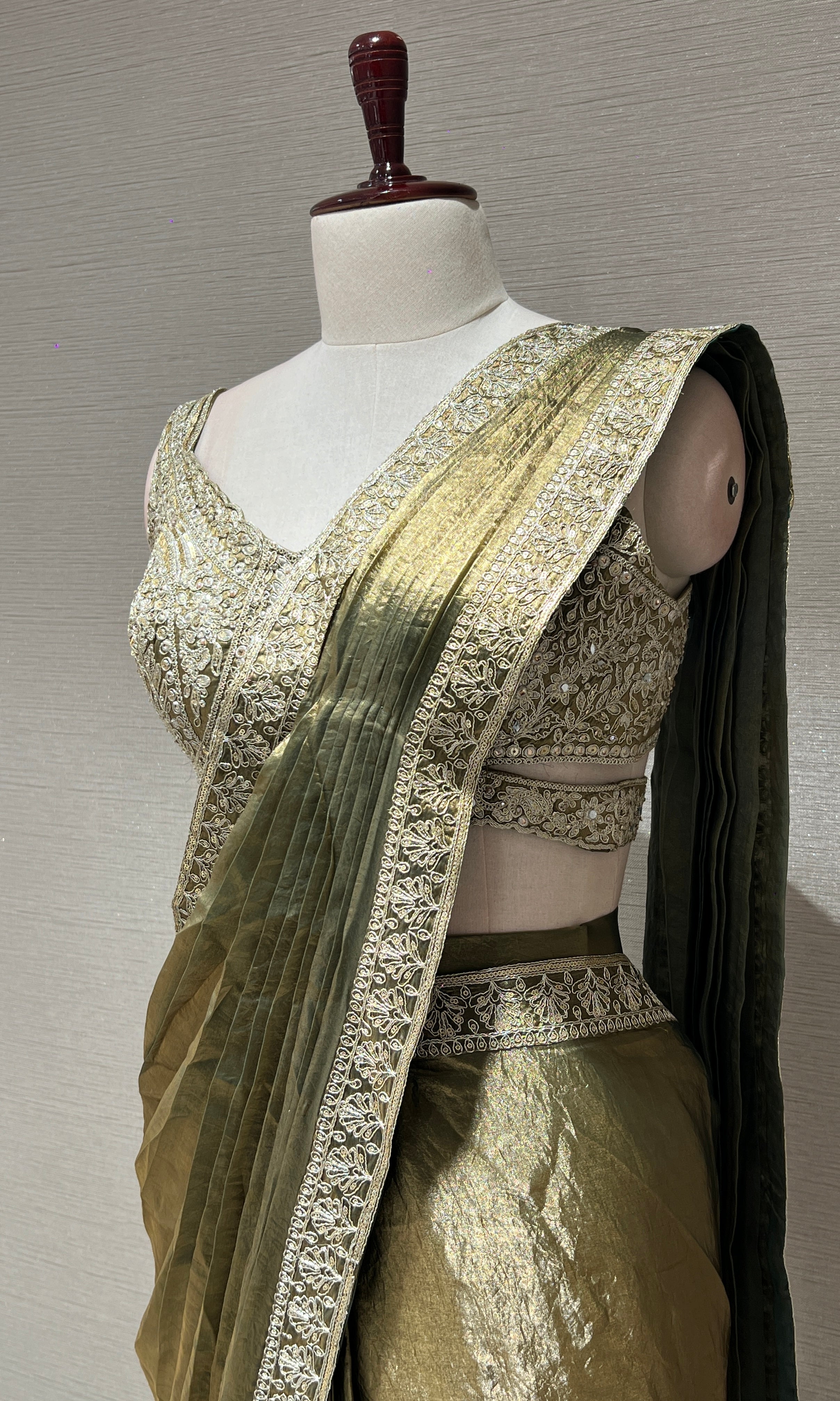 metallic green drape saree with gold border