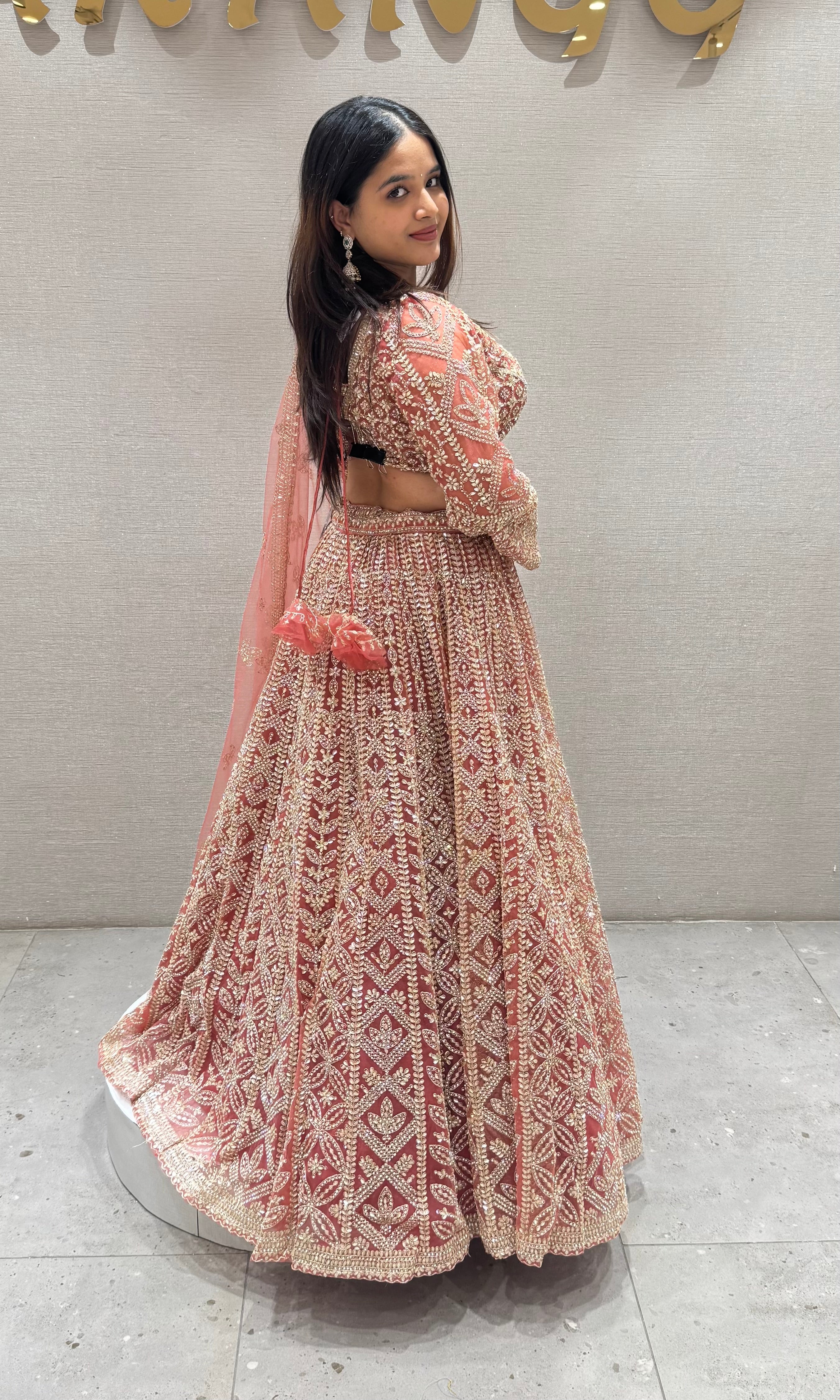 Peachy Orange lehenga with stone work