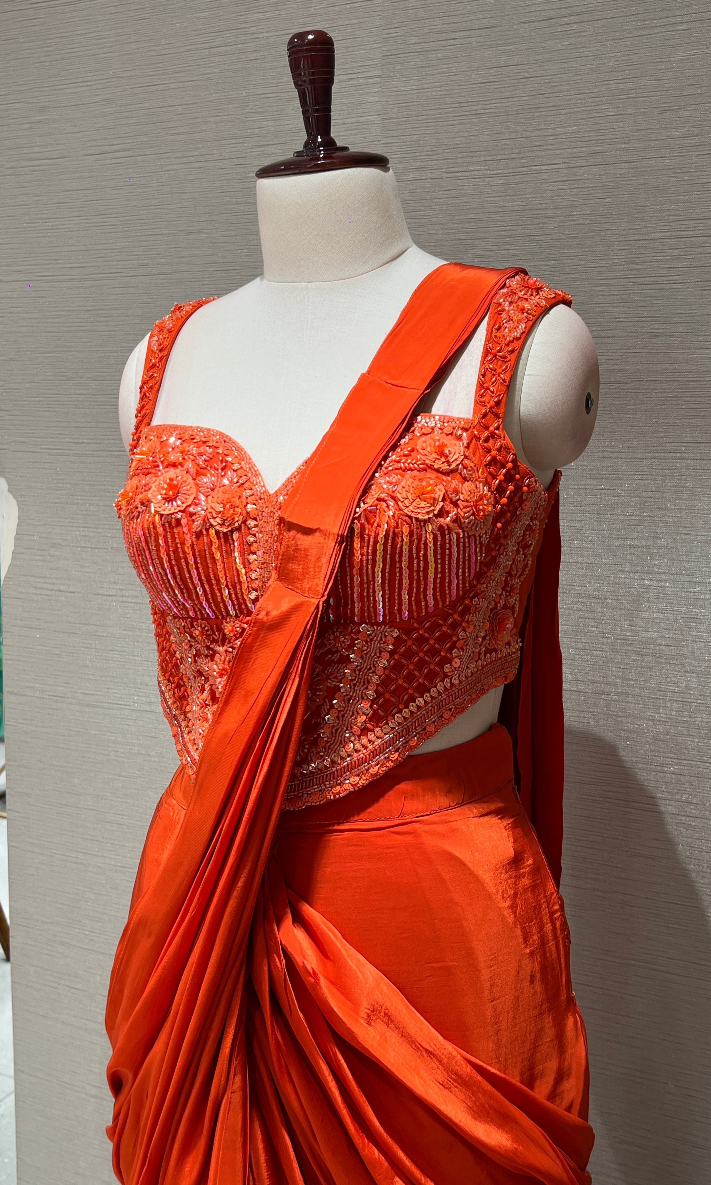 Orange drape saree with corset blouse