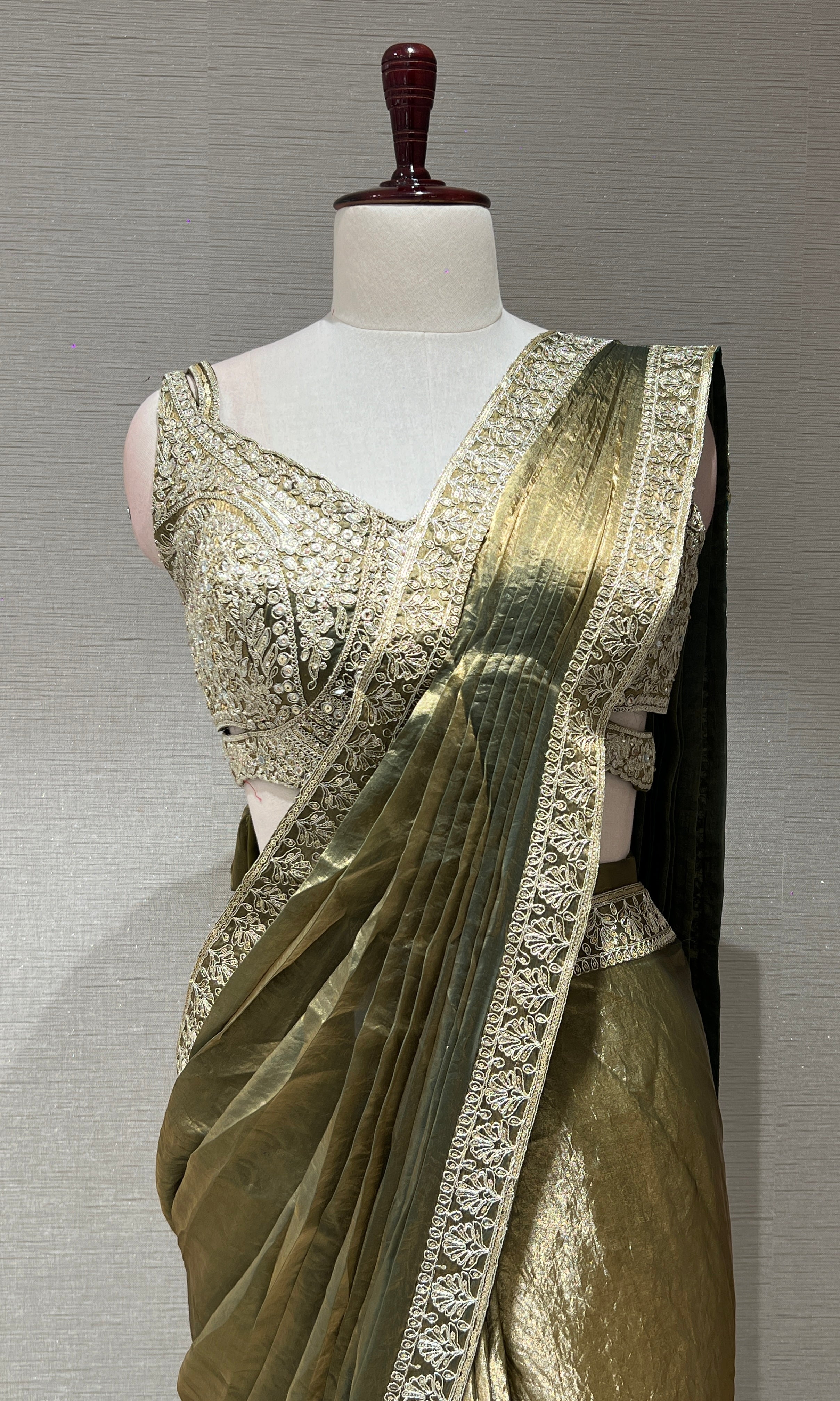 metallic green drape saree with gold border