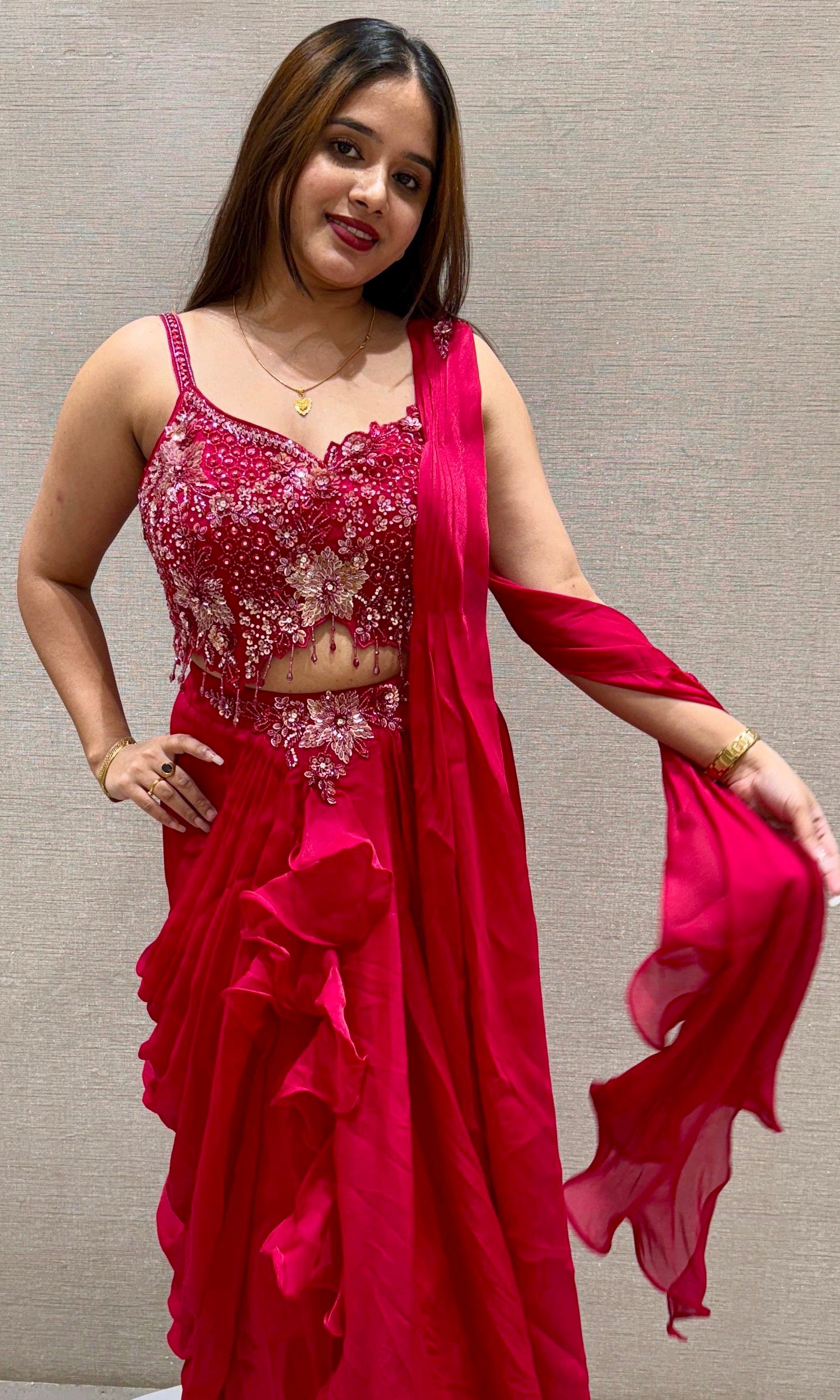 Red drape saree with embellished blouse