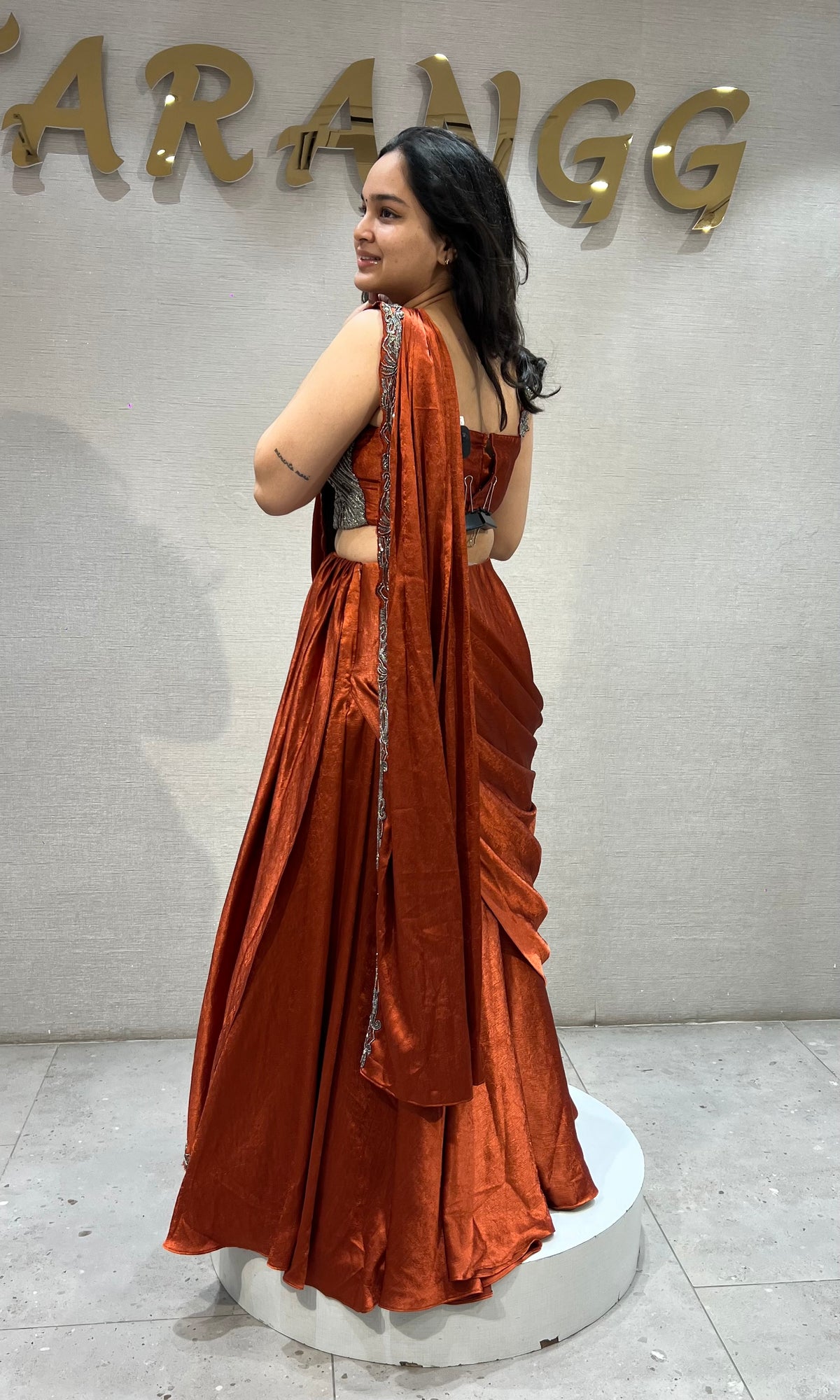 Rust Orange satin Draped lehenga with Silver embroidered Blouse