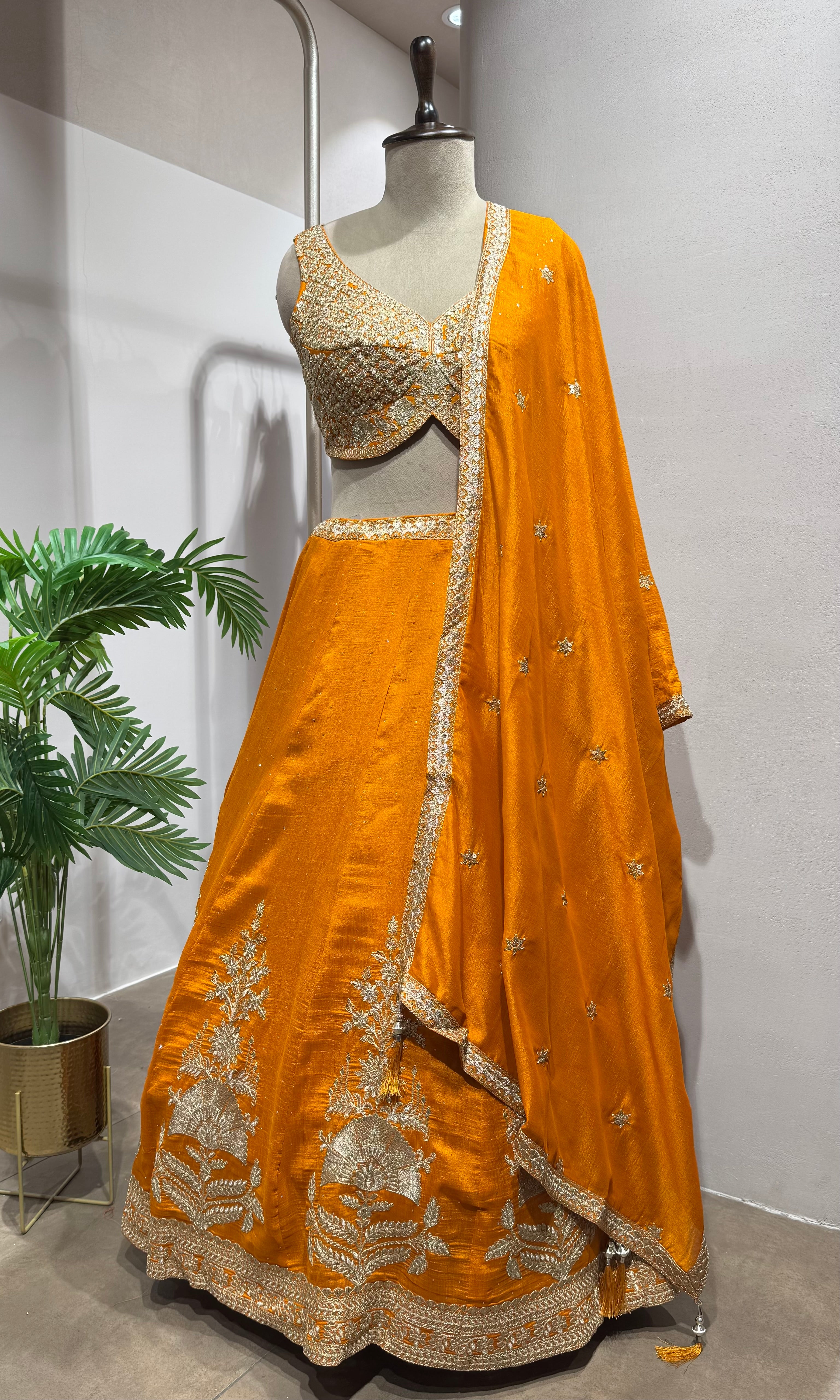 orange silk lehenga set with gold embroidery