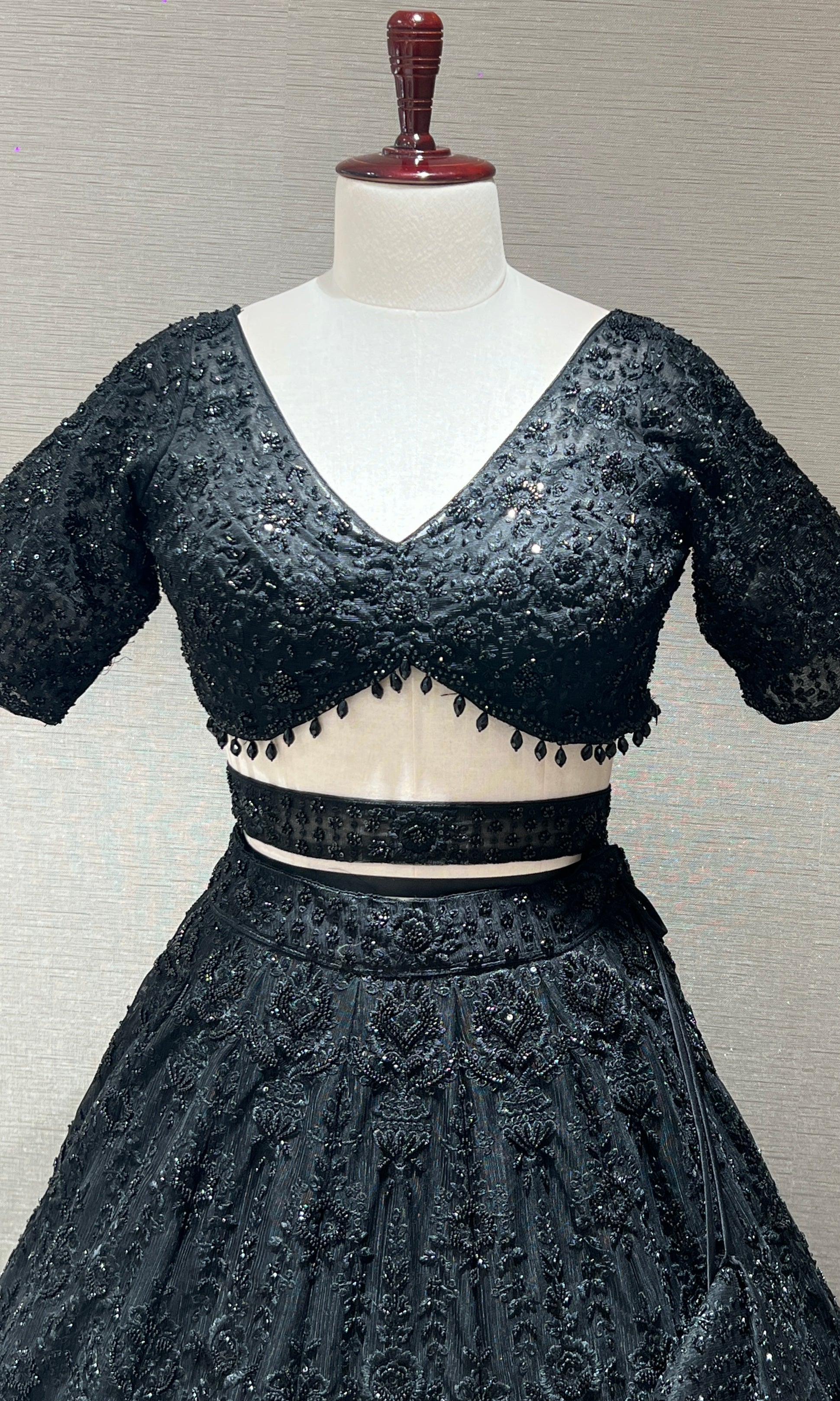 Black lehenga with pretty blouse and netted dupatta