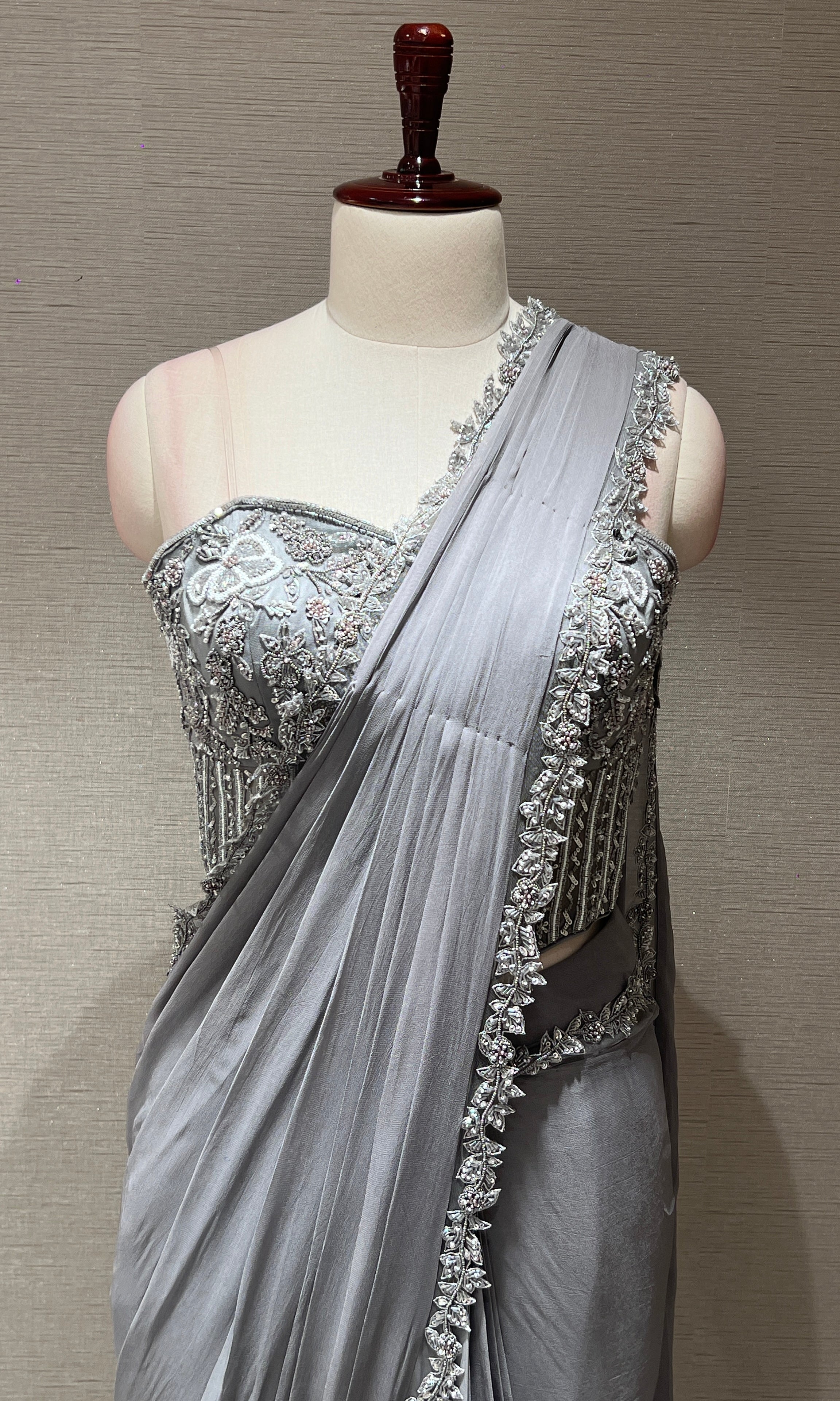 grey drape saree with embroidered corset blouse