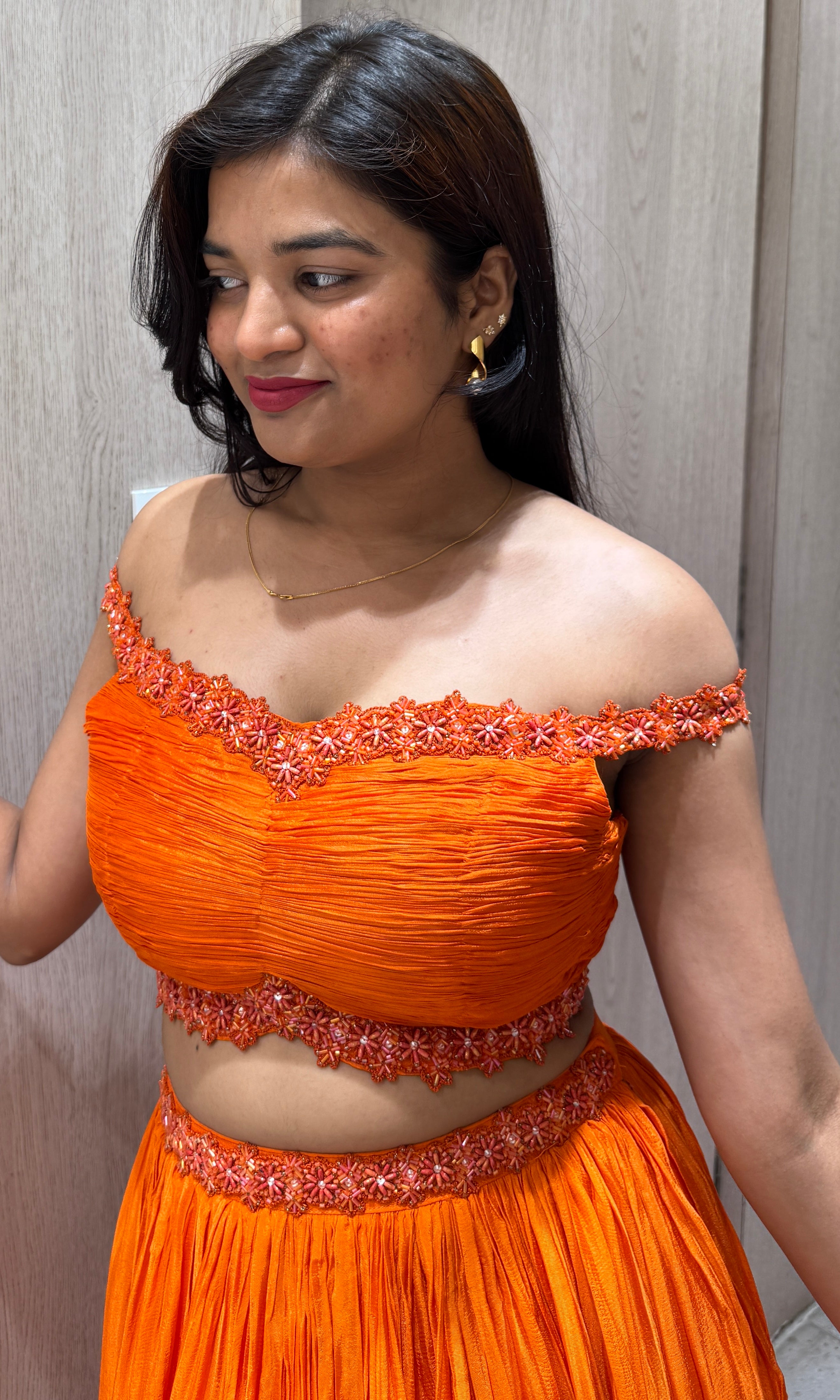 Orange lehenga with cold shoulder blouse 1000