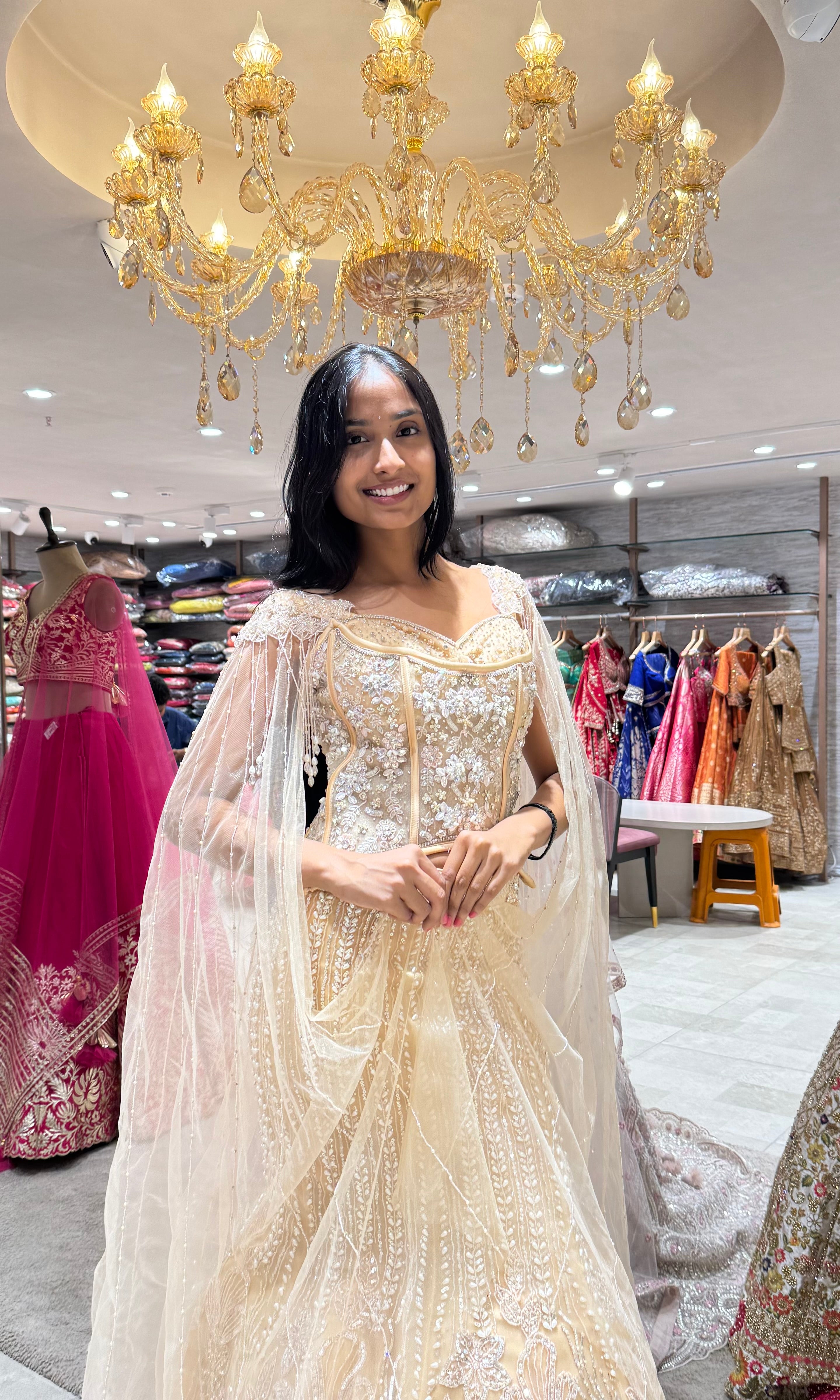 GOLD LEHENGA WITH CORSET BLOUSE & CAPE