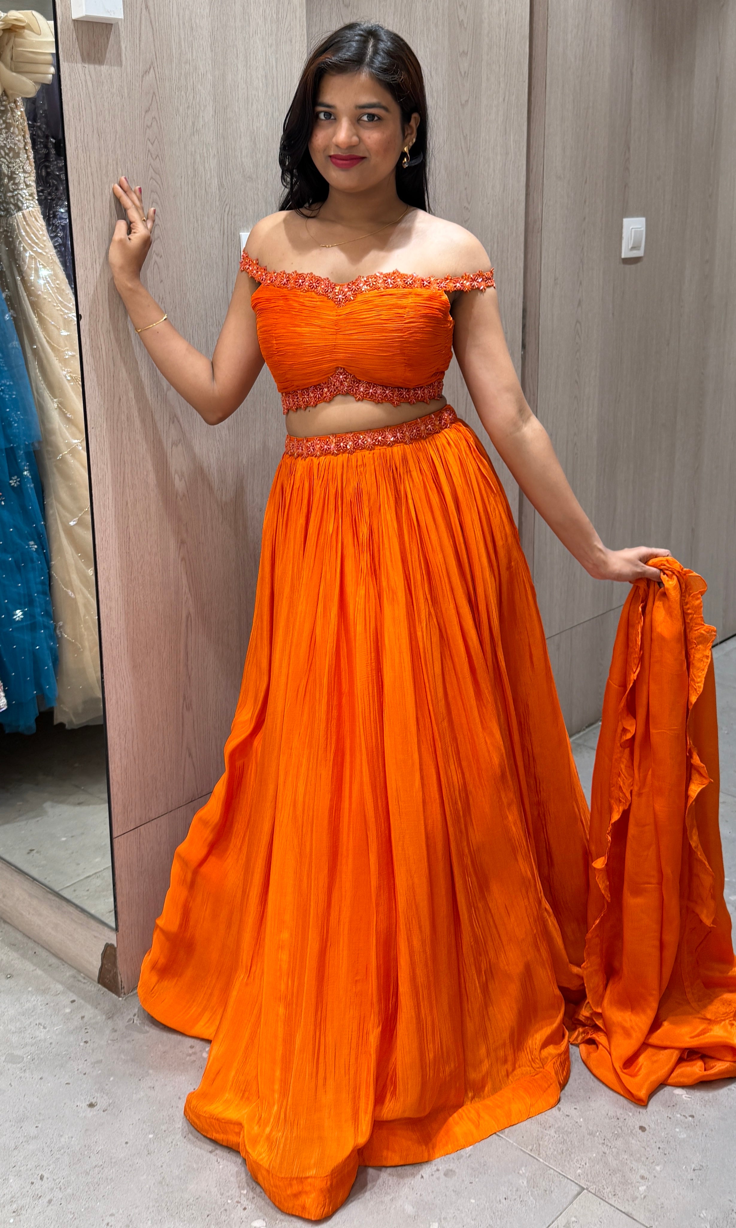 Orange lehenga with cold shoulder blouse 1000