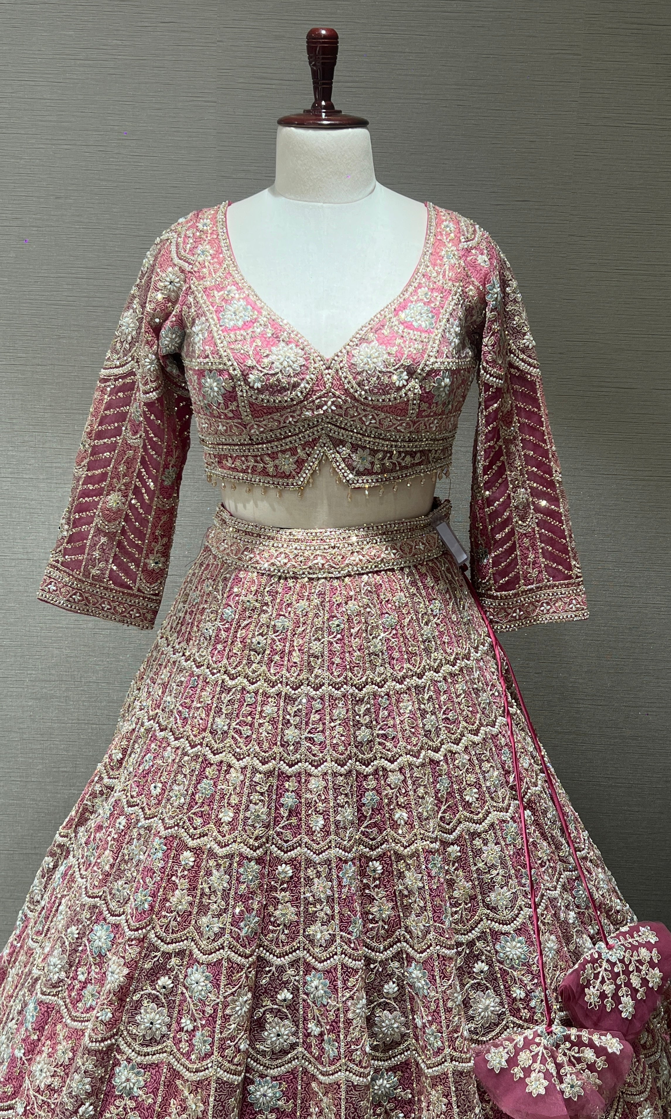 Pink lehenga with intricate embroidery and zari work