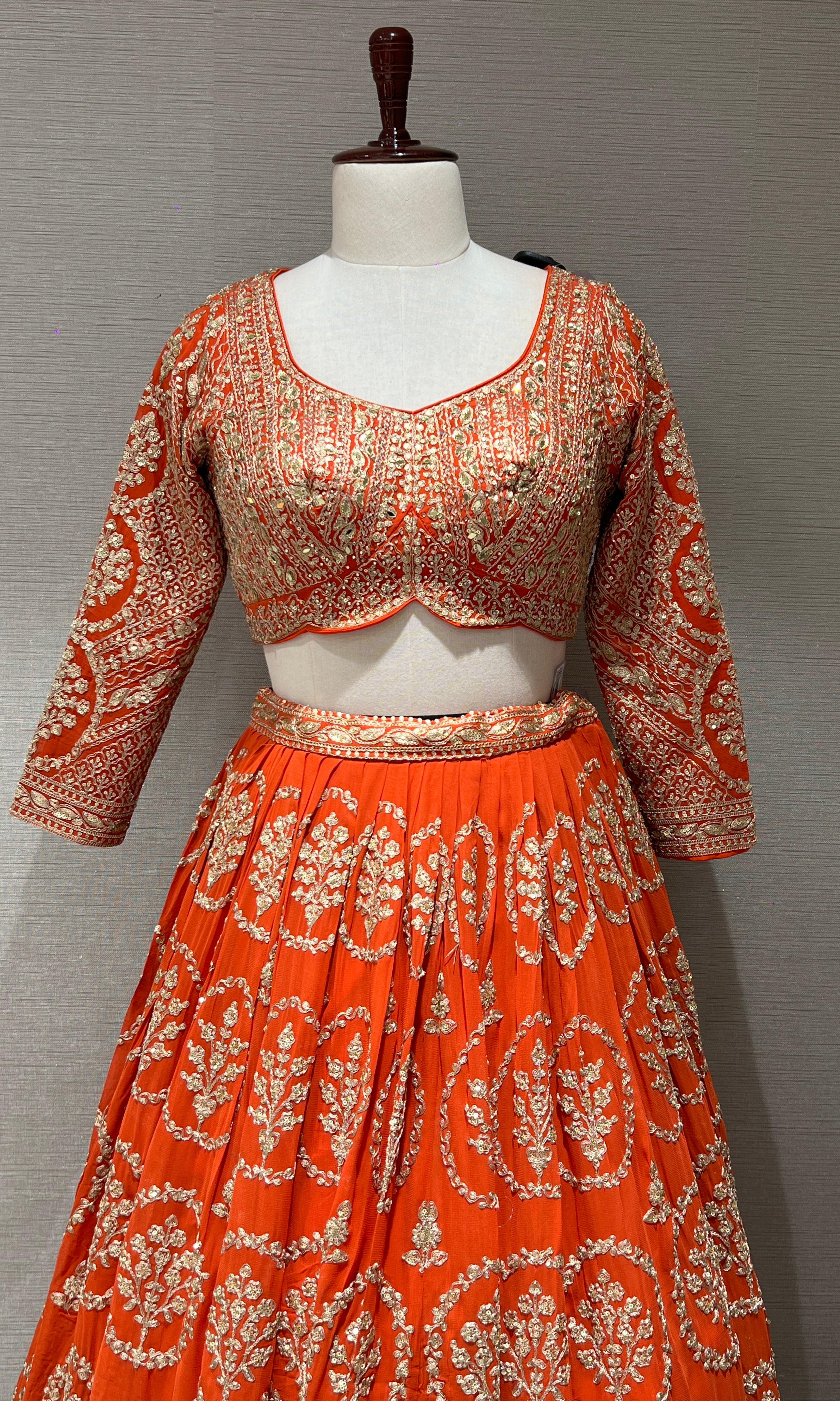 Orange Lehenga with zari and sequin gold embroidery