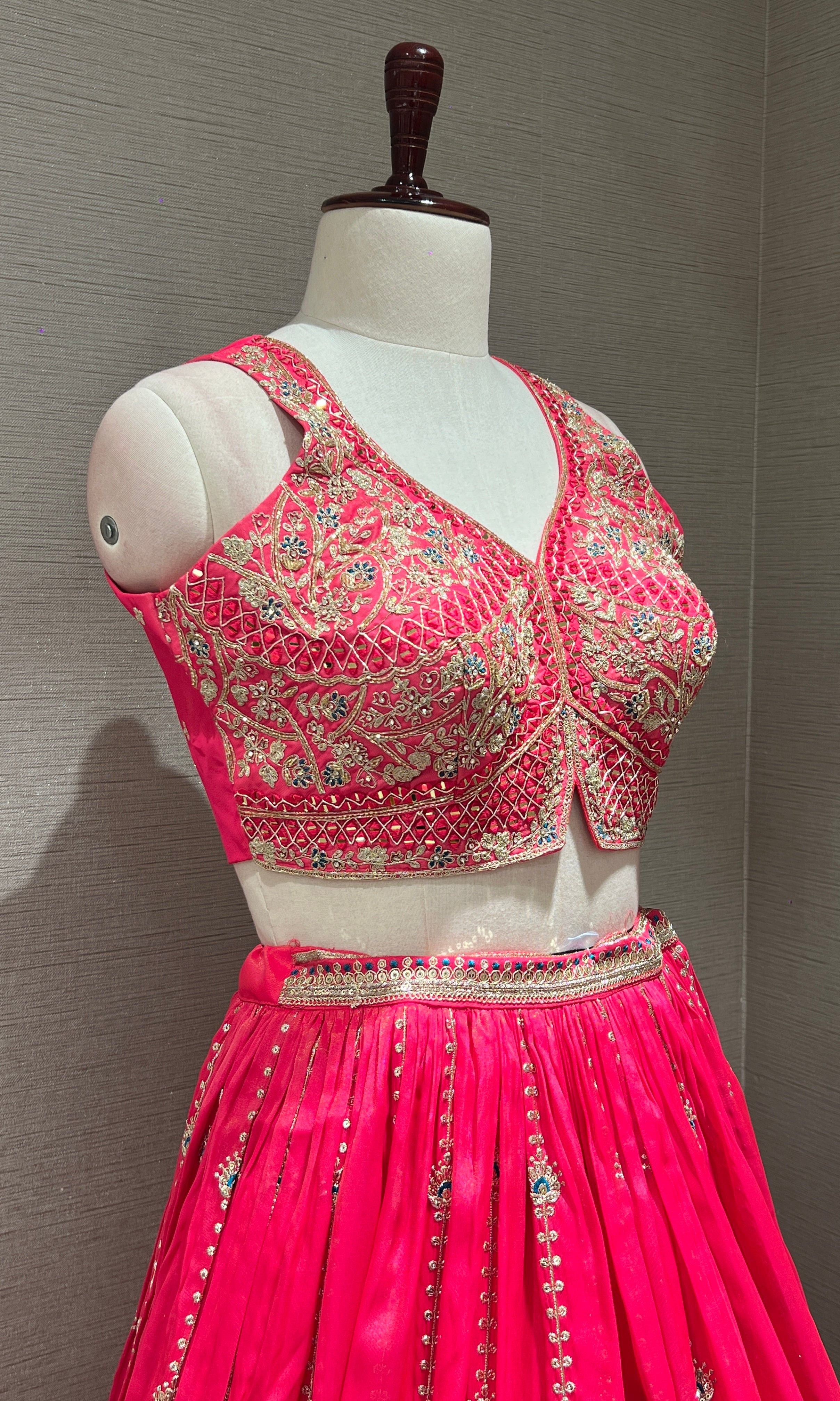 rani pink lehenga with intricate embroidery