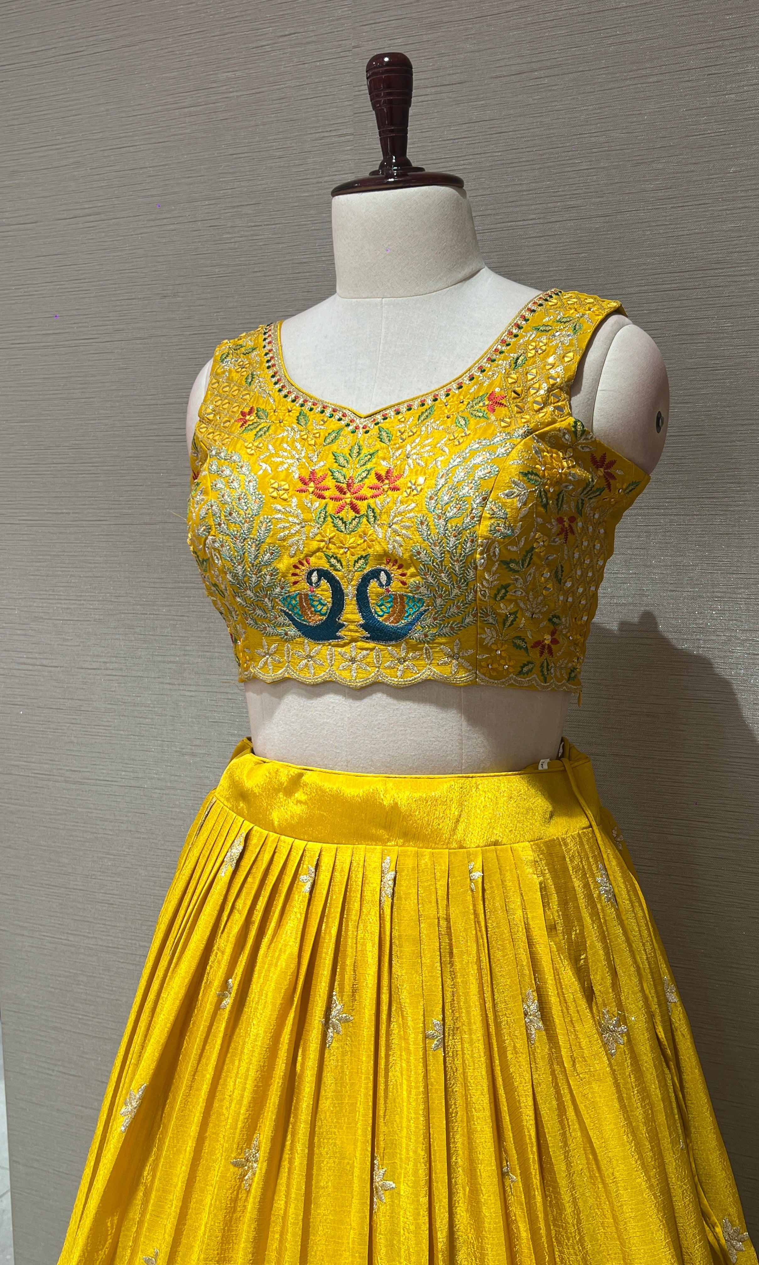yellow lehenga with peacock design