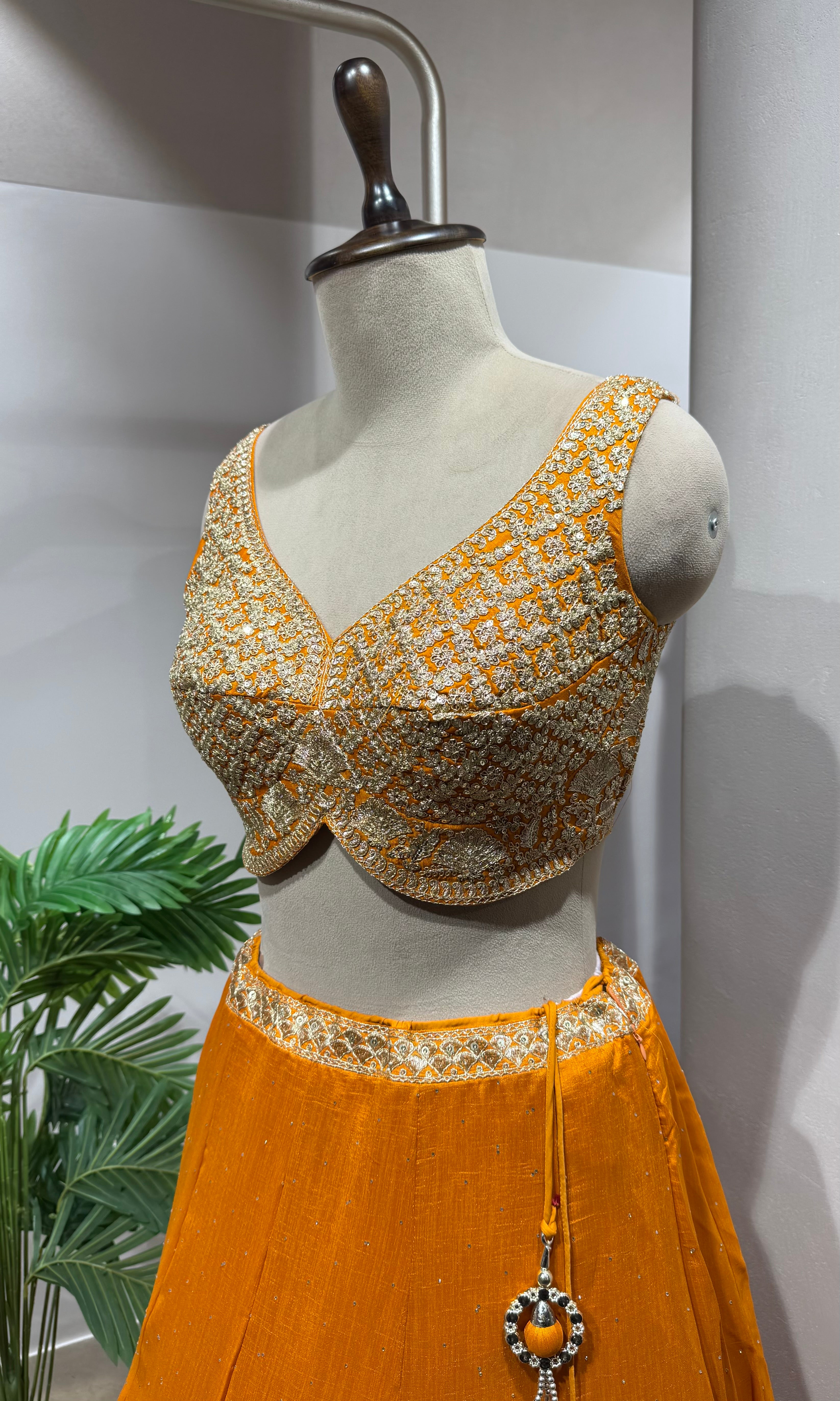 orange silk lehenga set with gold embroidery