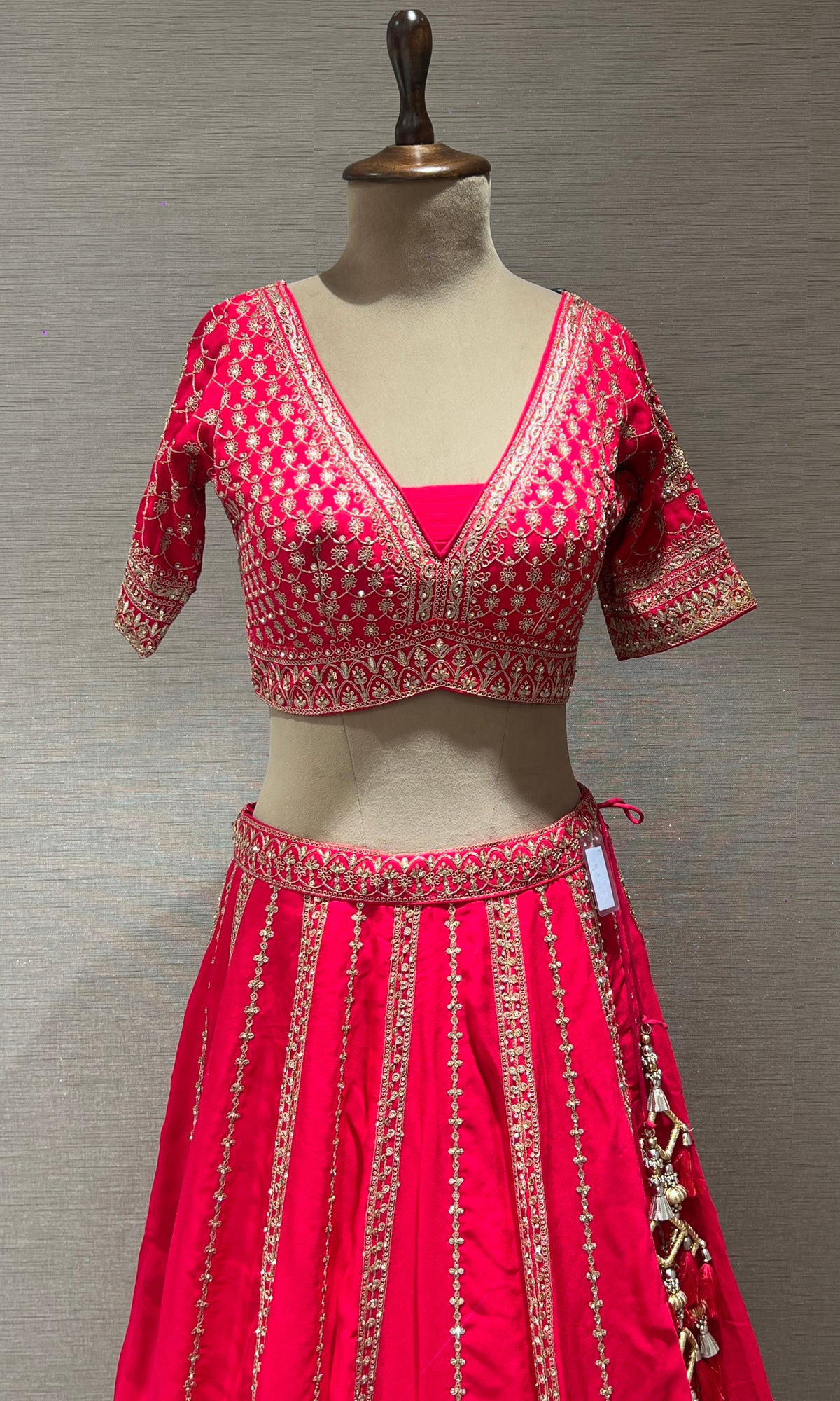 rani pink lehenga with intricate embroidery