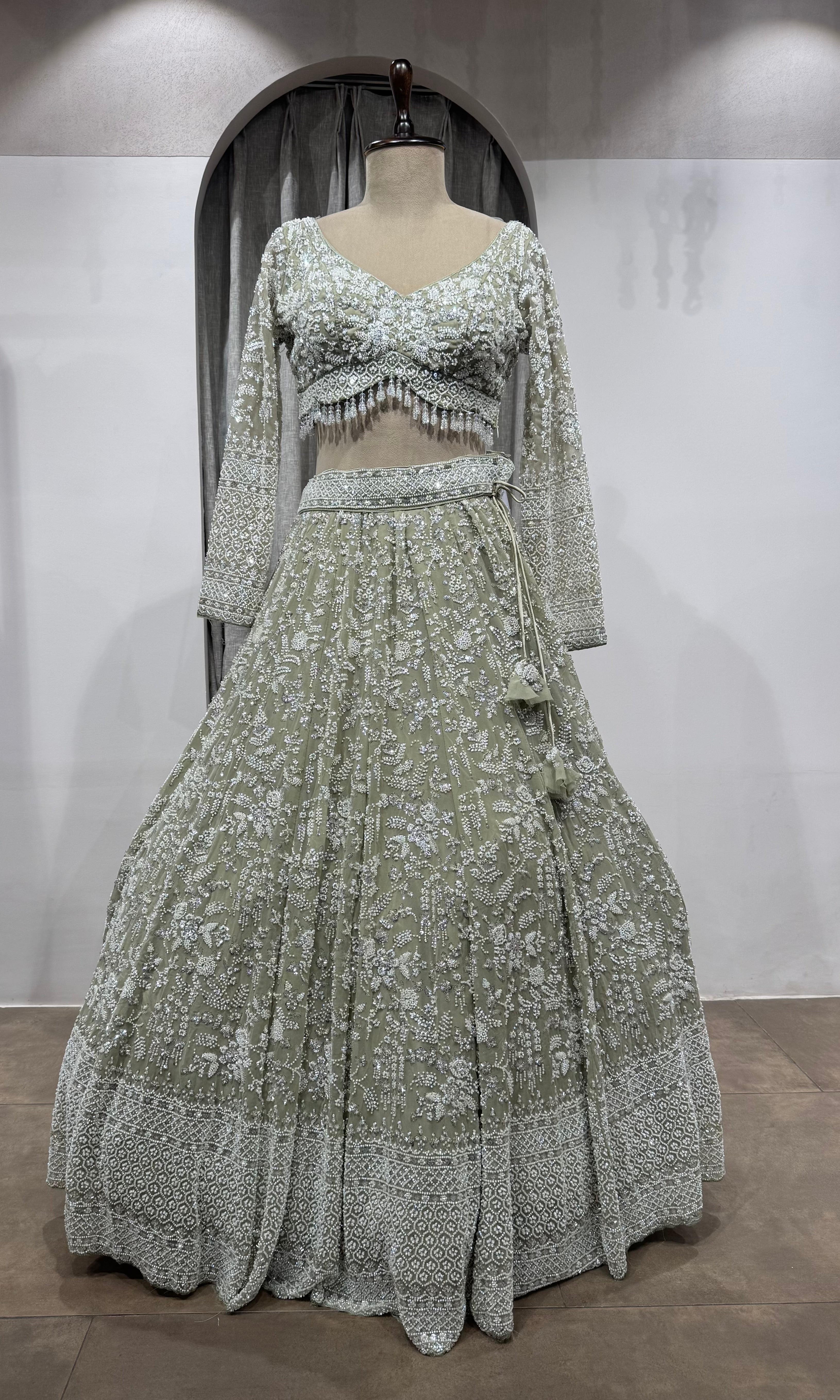 Sage Green Heavily Embroidered Net Bridal Lehenga
