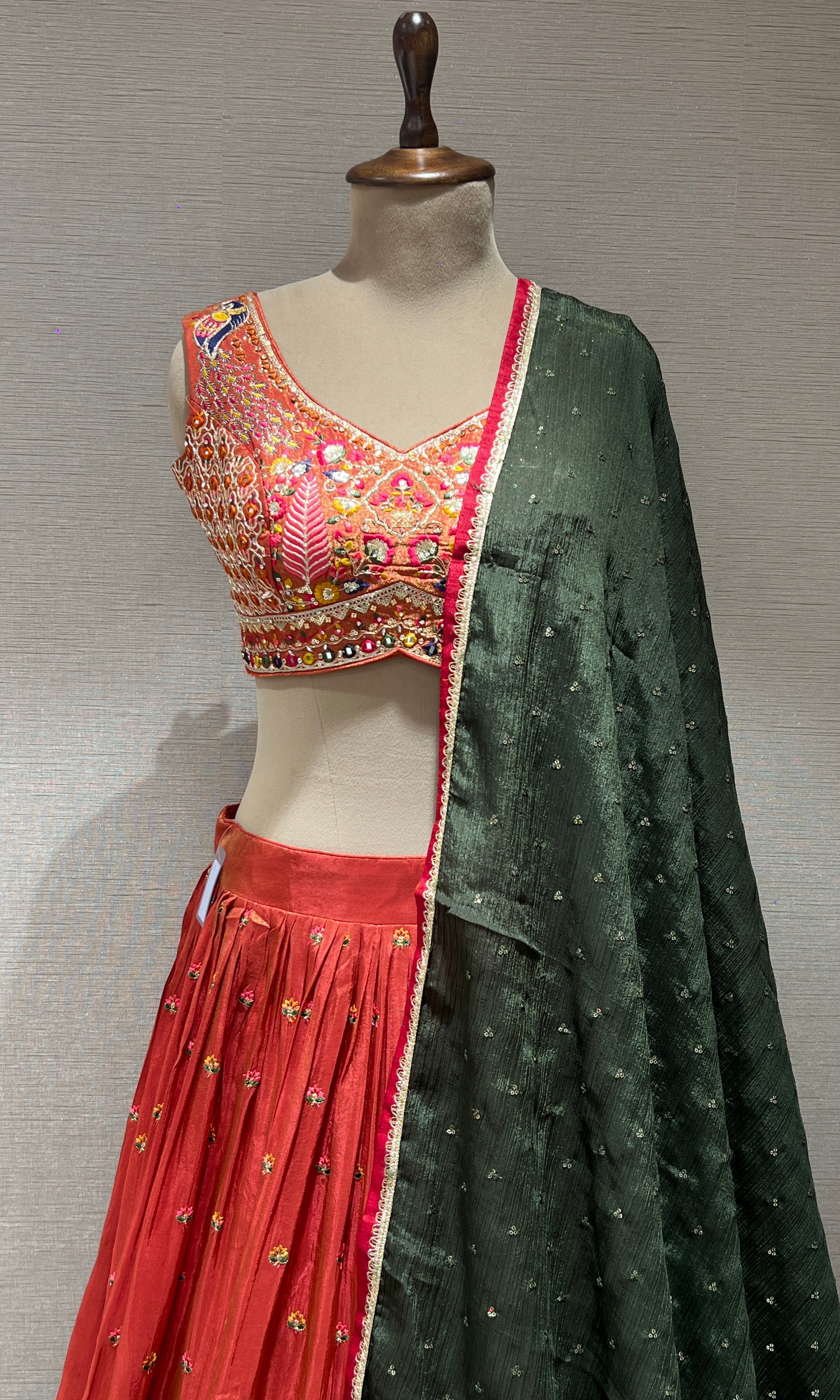 Rust and green embroidered lehenga choli