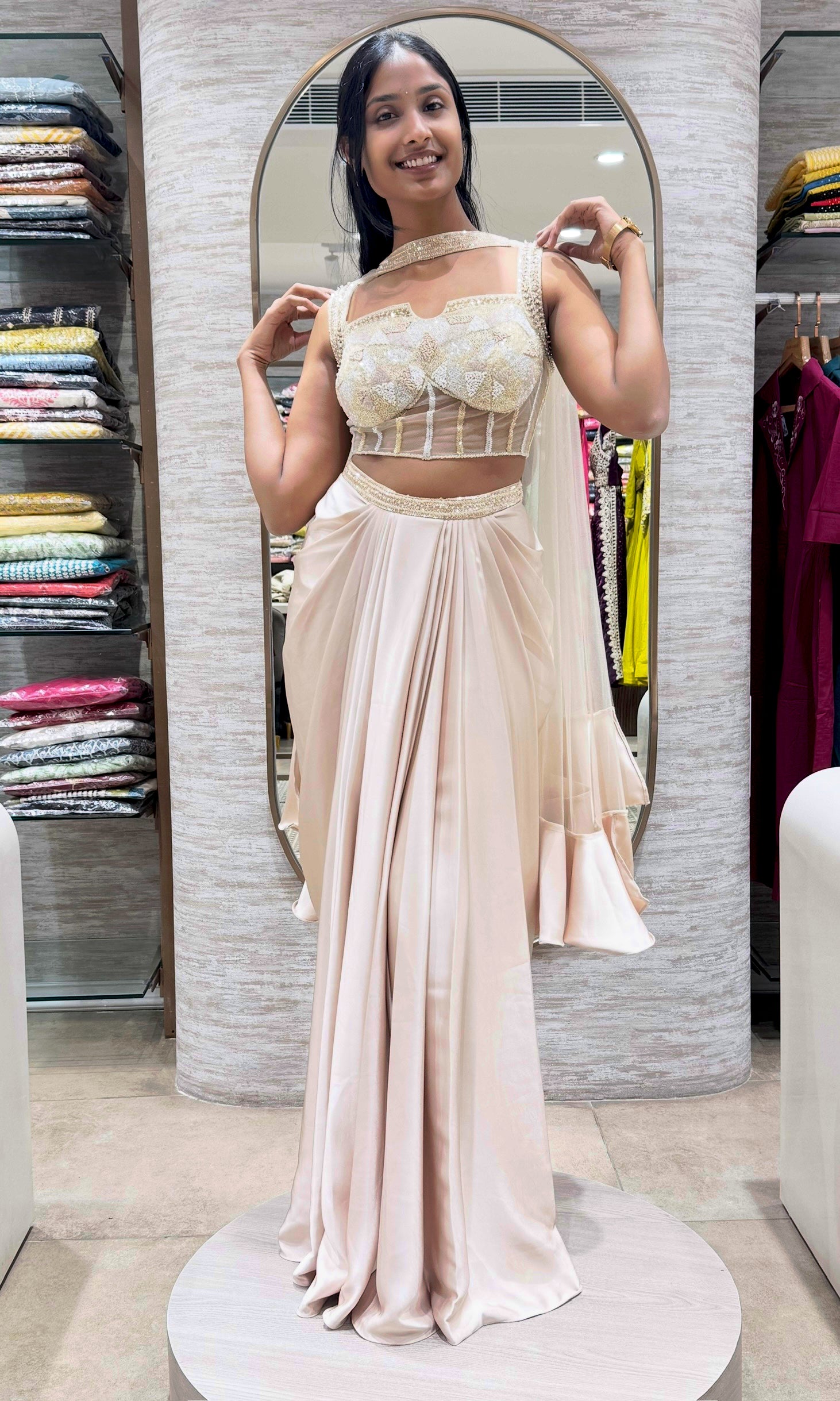half white drape saree with corset blouse and cape