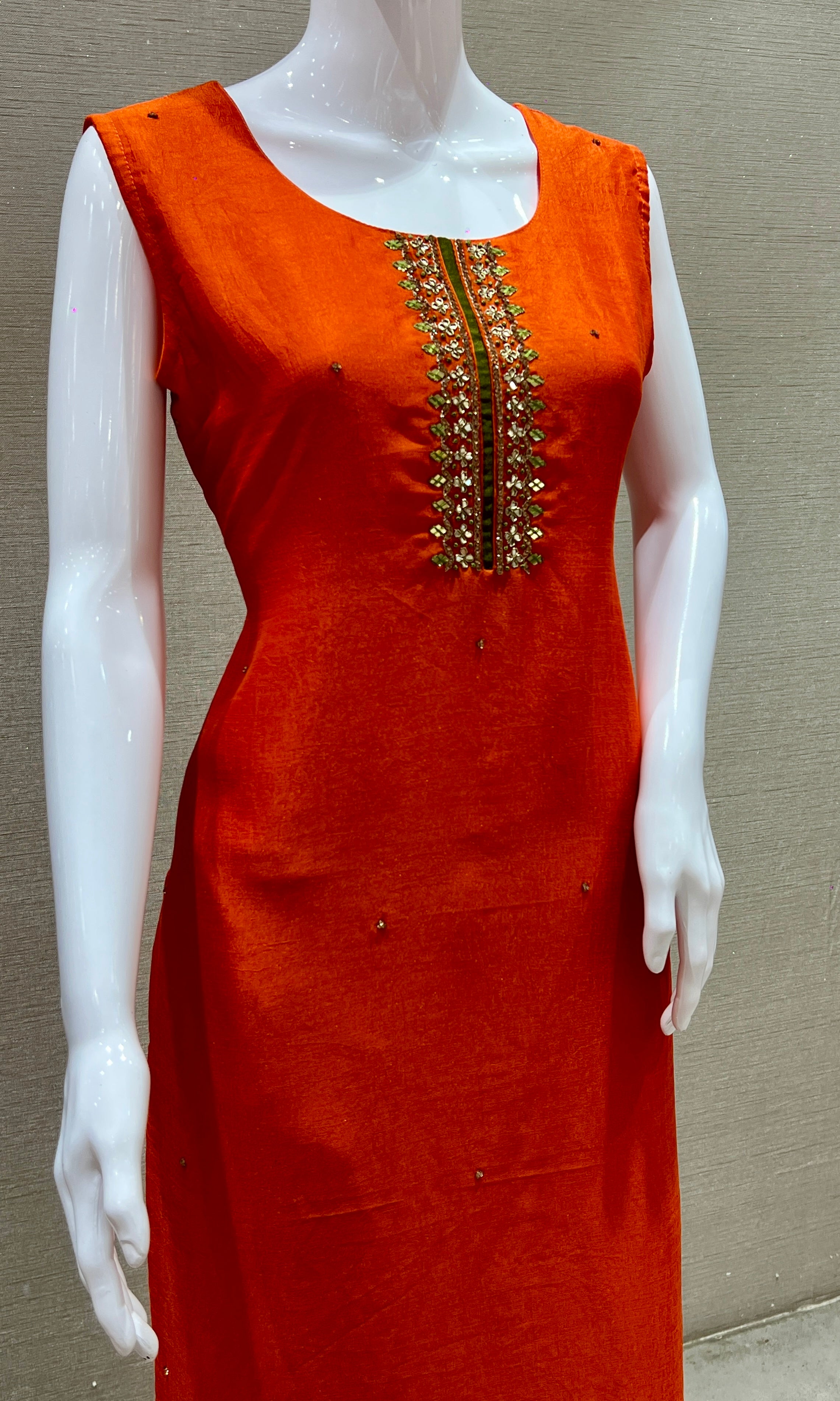 Orange kurta set with green Contrast dupatta