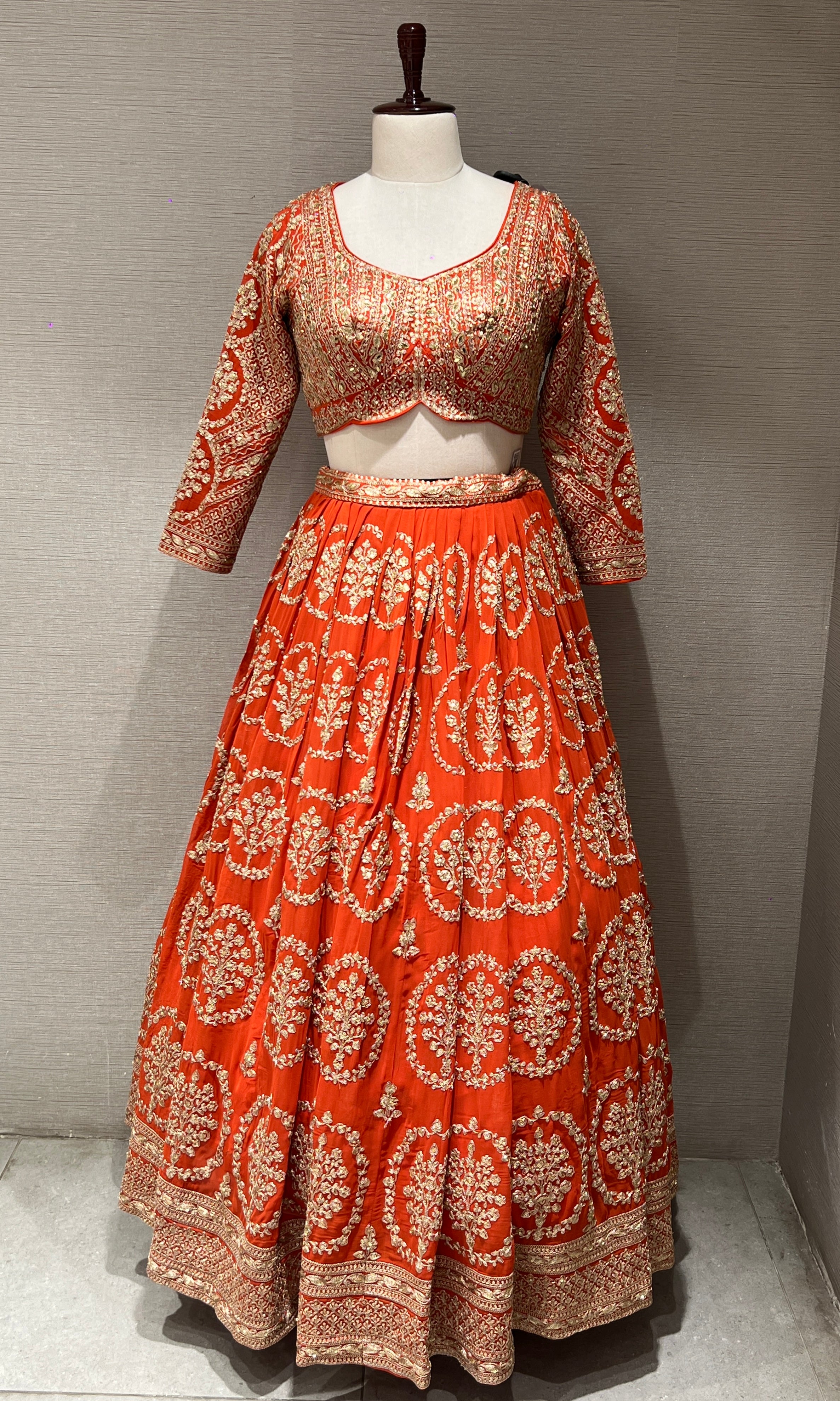 Orange Lehenga with zari and sequin gold embroidery