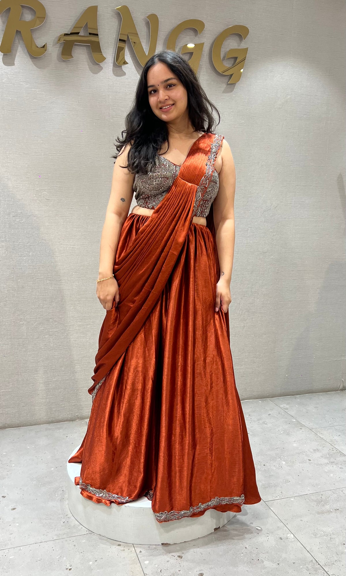 Rust Orange satin Draped lehenga with Silver embroidered Blouse