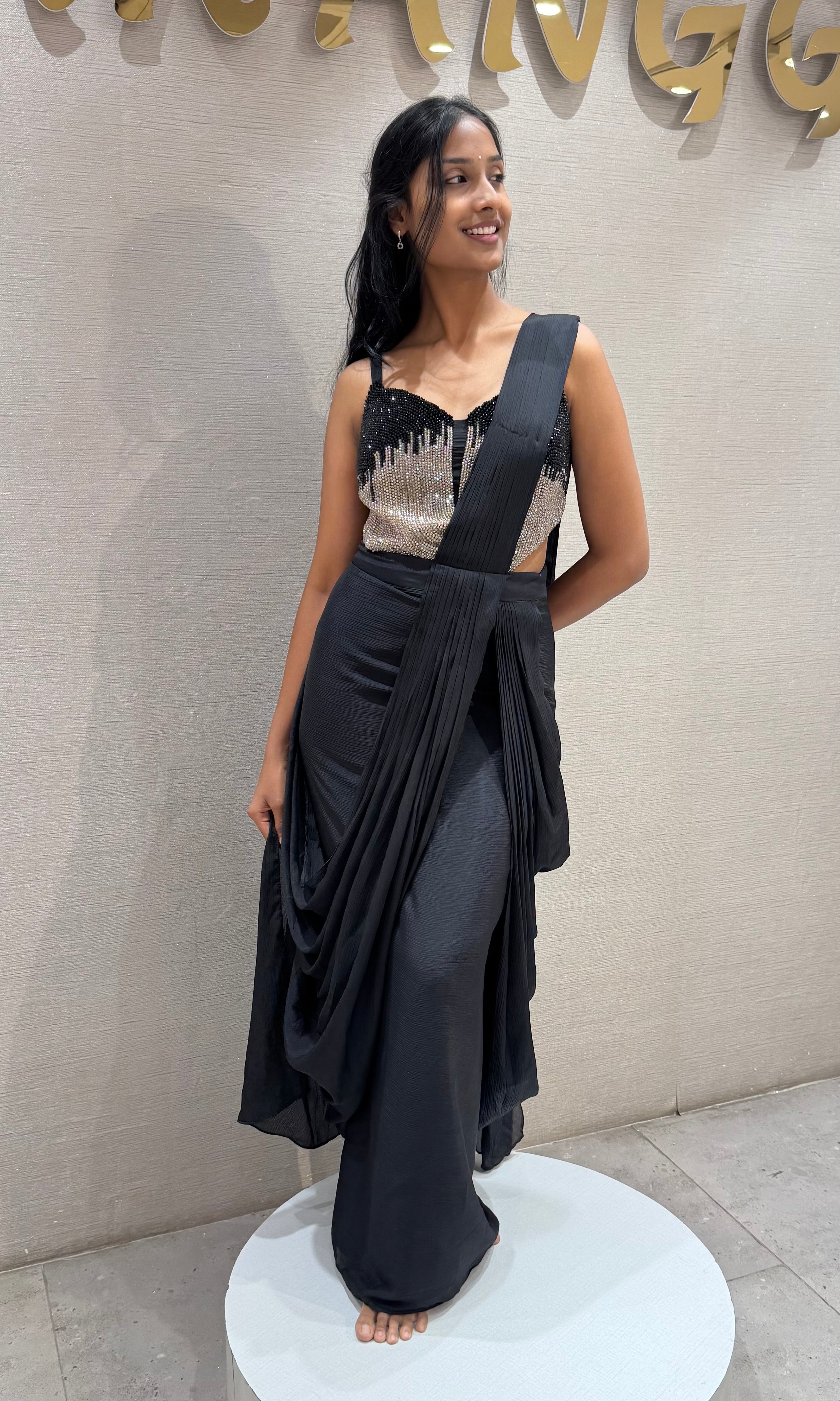 black draped saree with sequined corset blouse