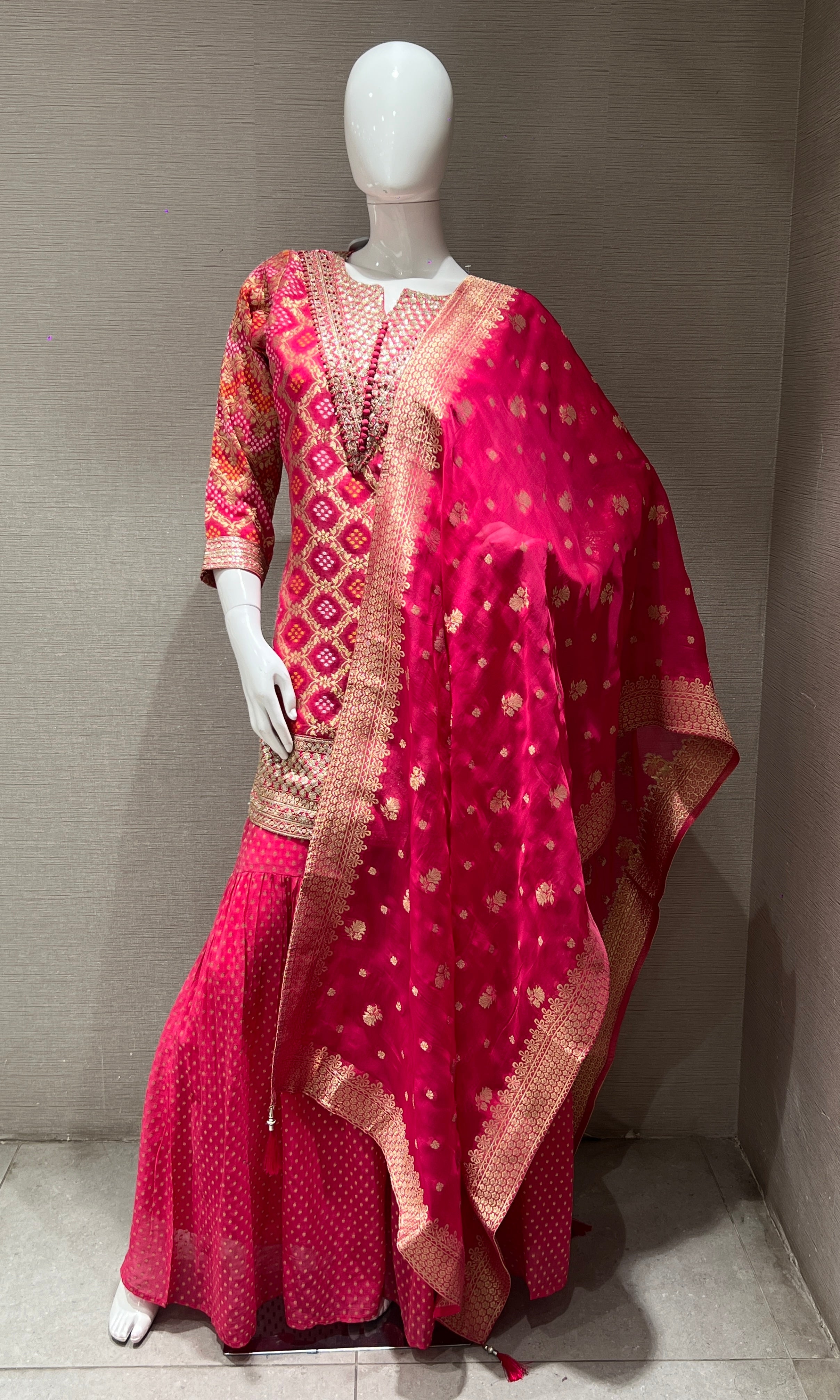 Pink embroidered sharara set with golden zari dupatta