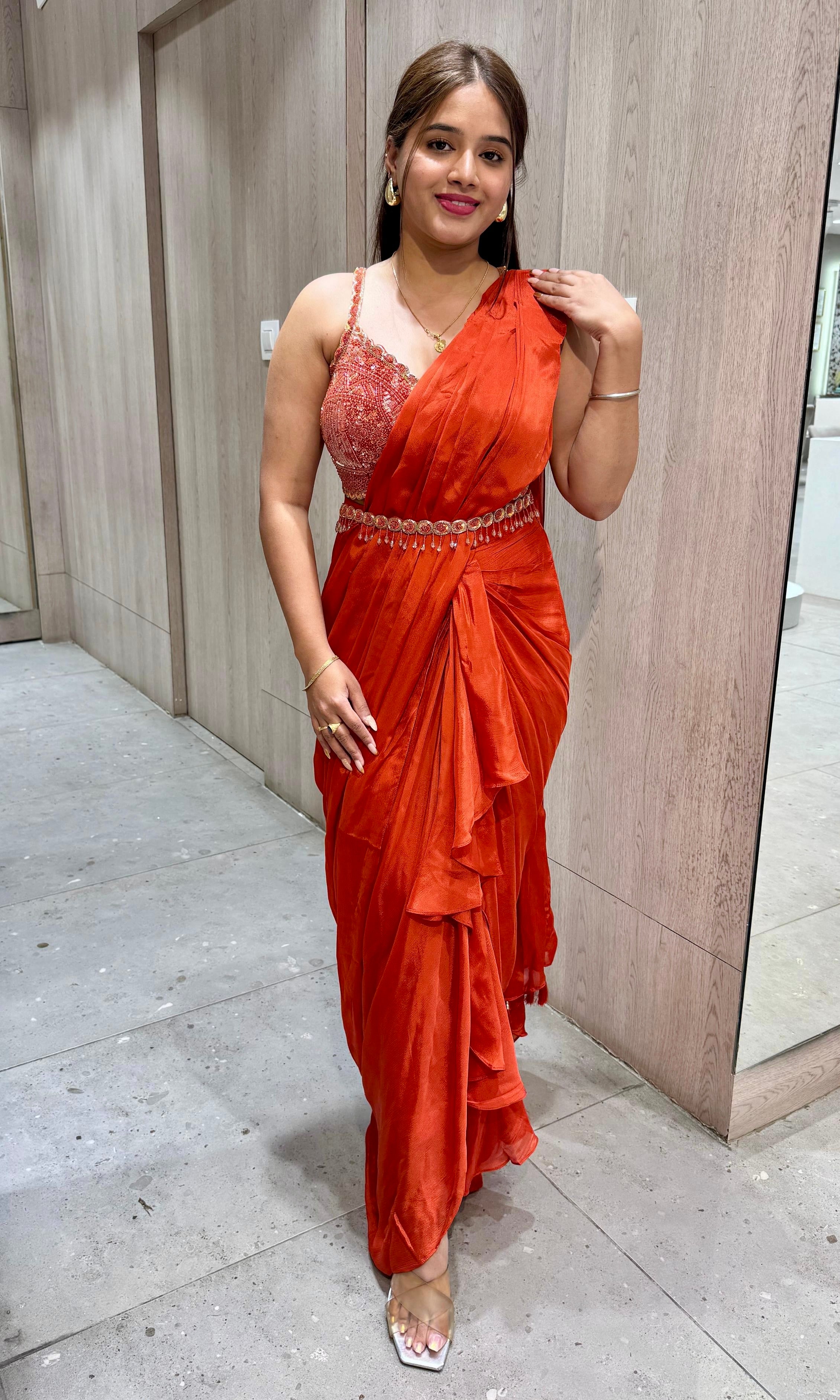 rust orange drape ruffled saree with blouse and belt
