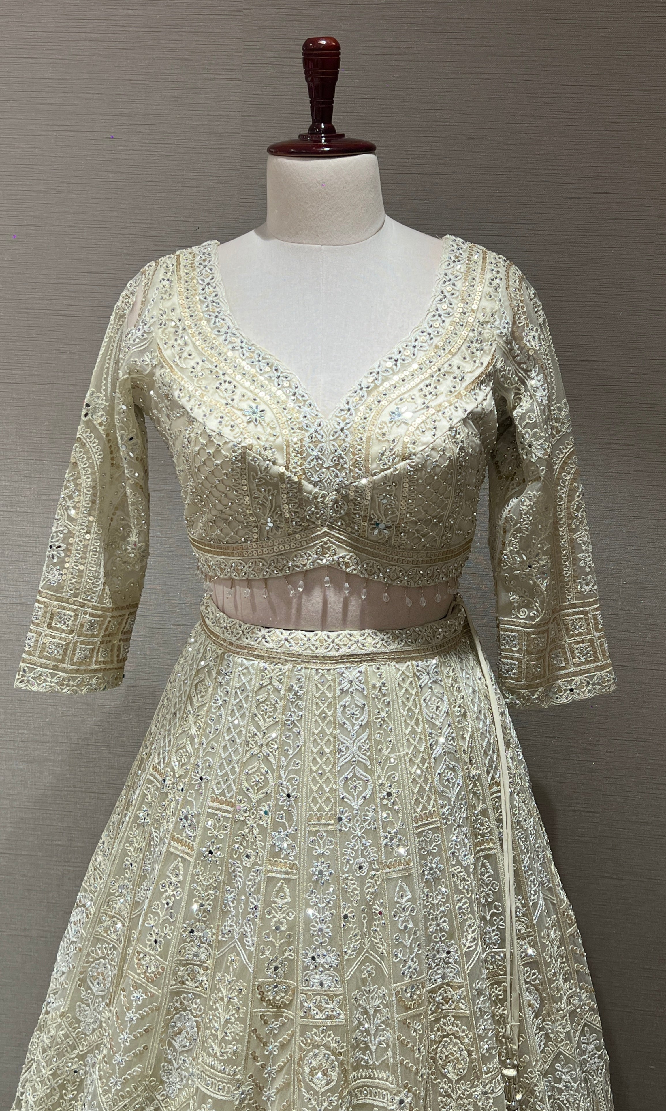 Half white ZARDOZI EMBROIDERED LEHENGA
