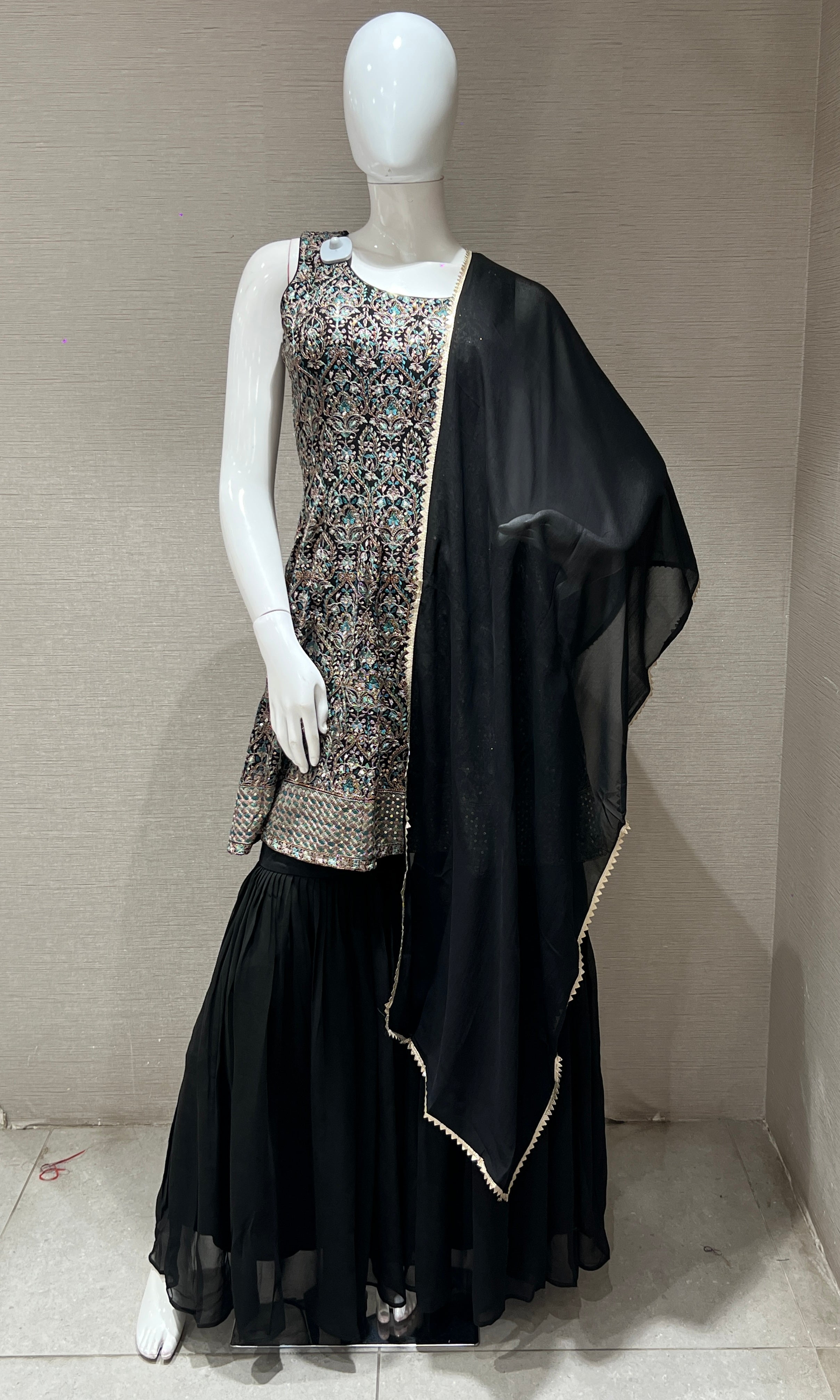 Black sharara with gold embroidery peplum top