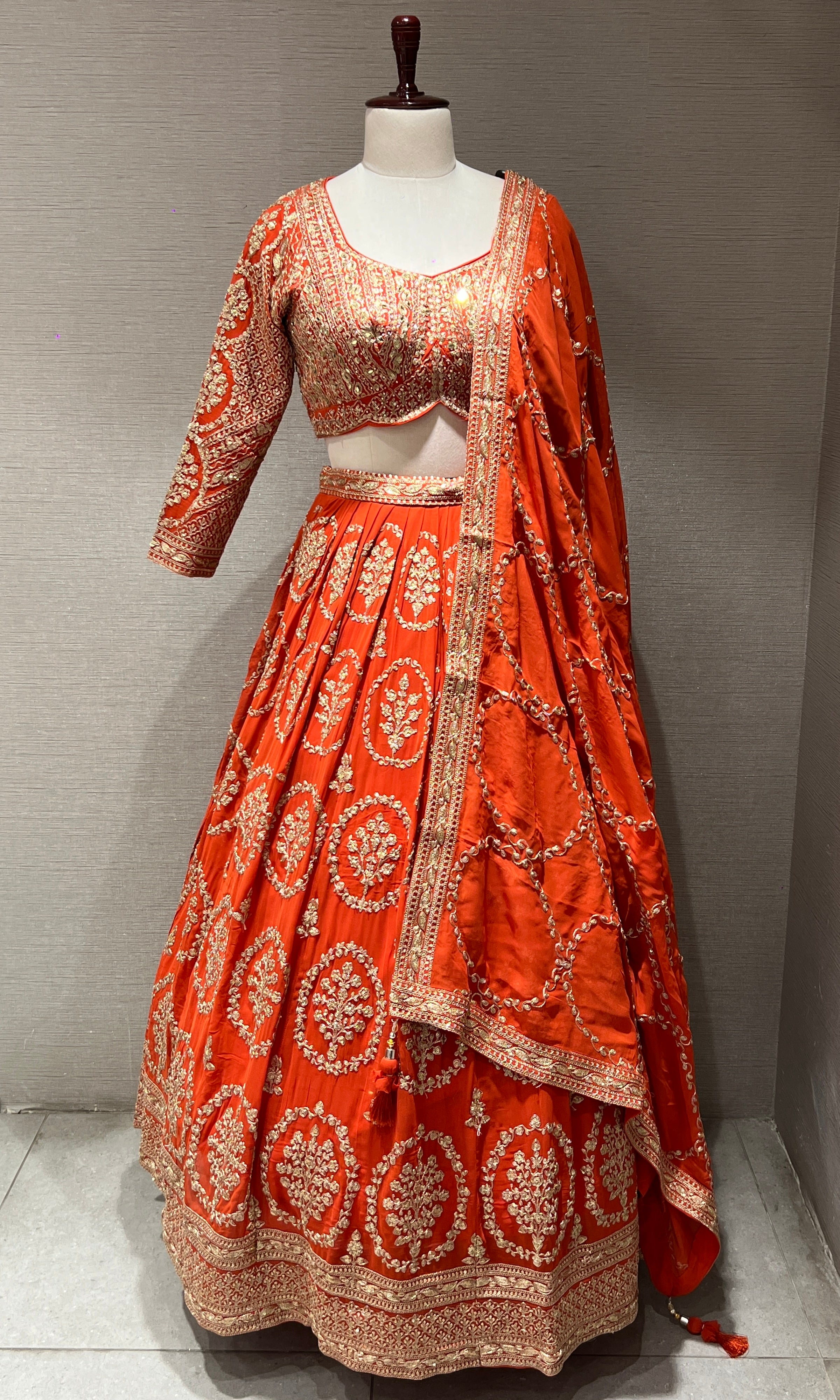 Orange Lehenga with zari and sequin gold embroidery