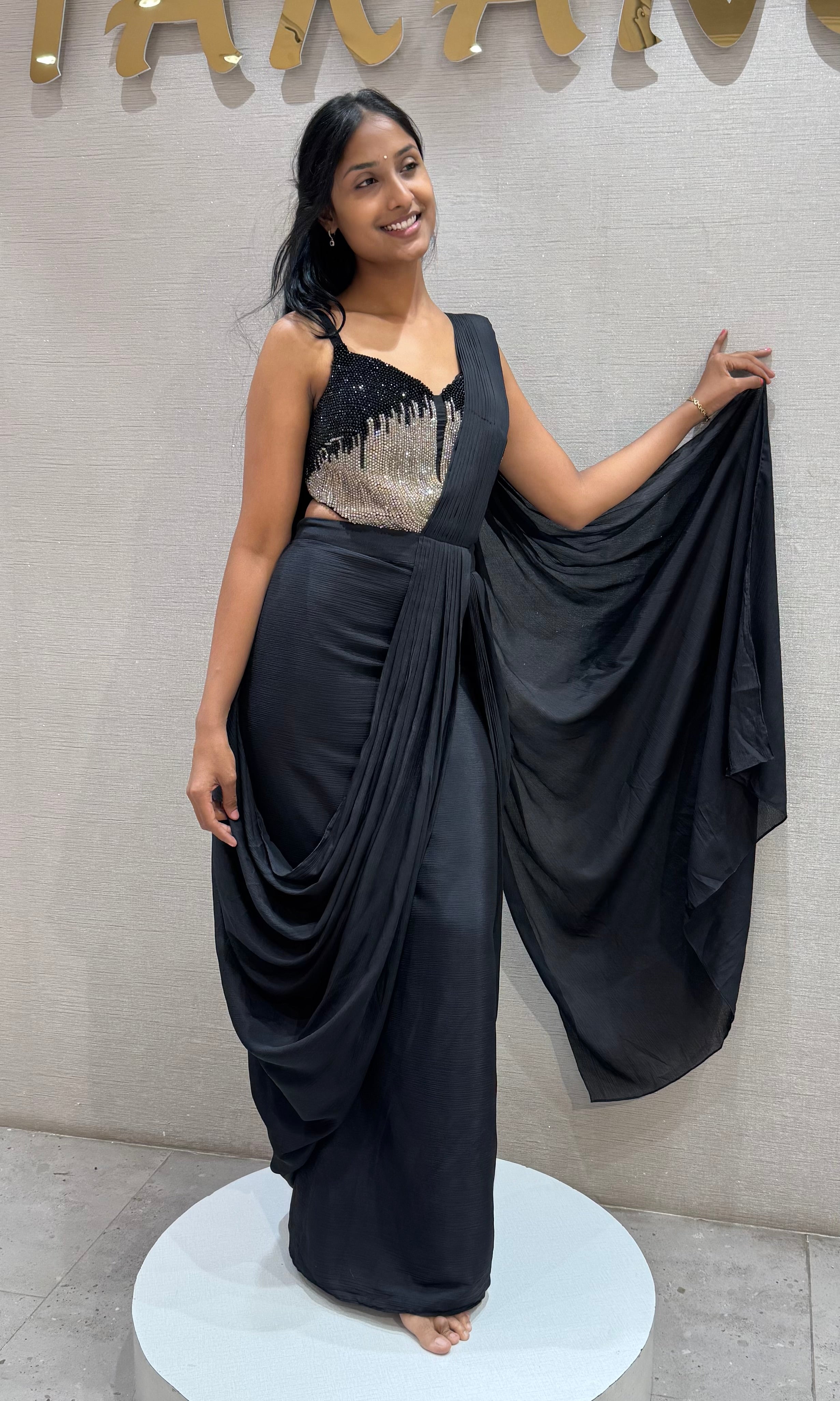 black draped saree with sequined corset blouse