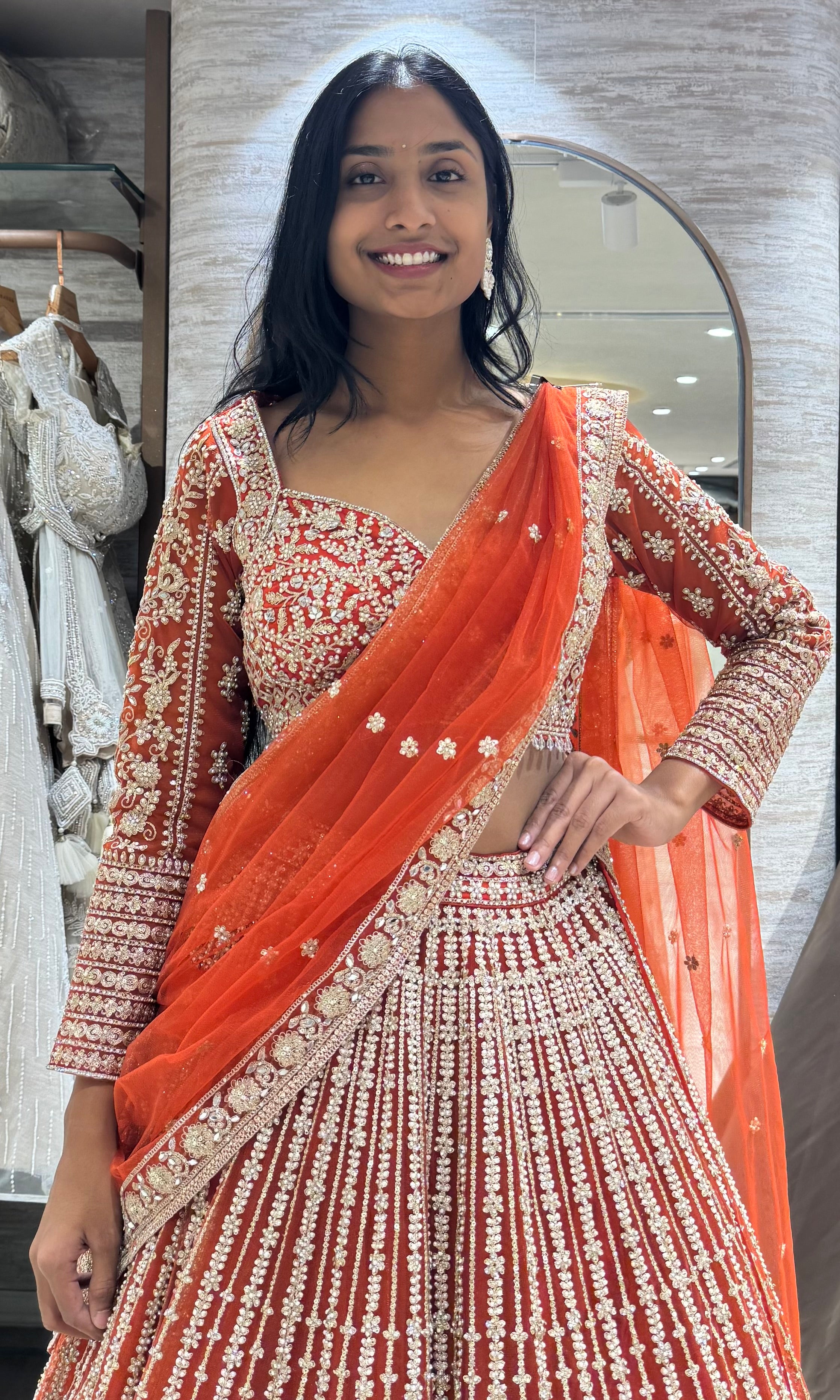 rust and white intricate embroidery lehenga