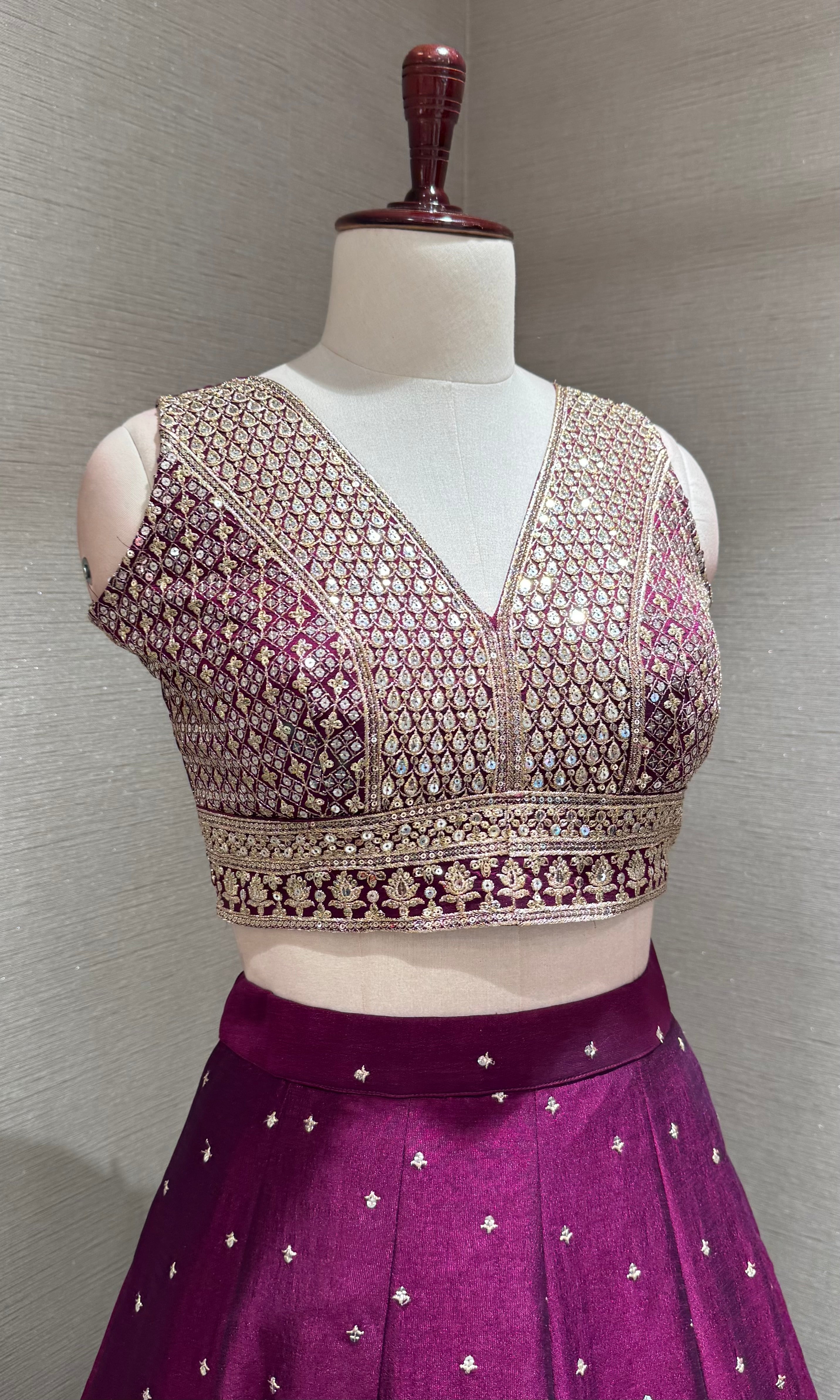Wine and gold embroidered Lehenga Choli