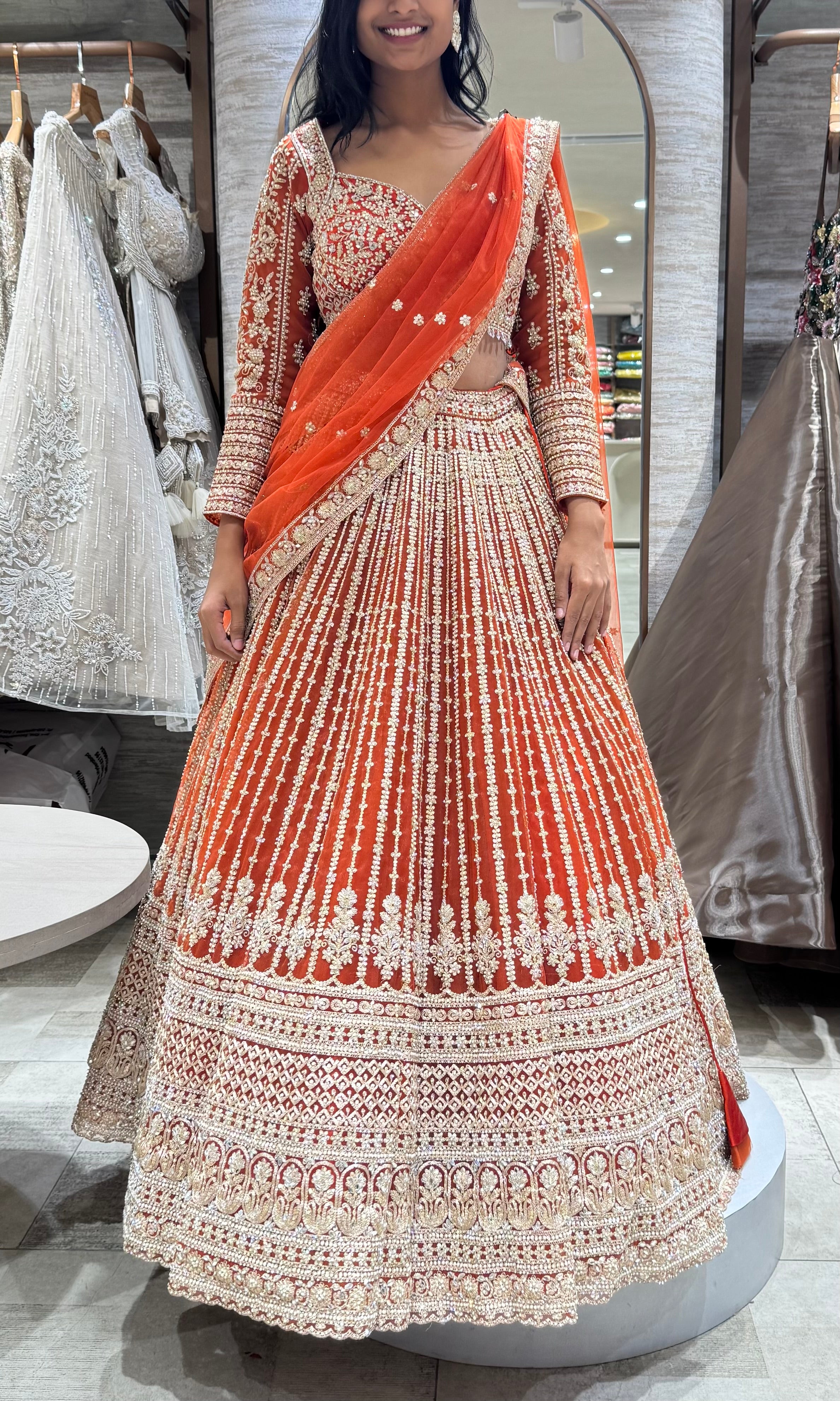 rust and white intricate embroidery lehenga