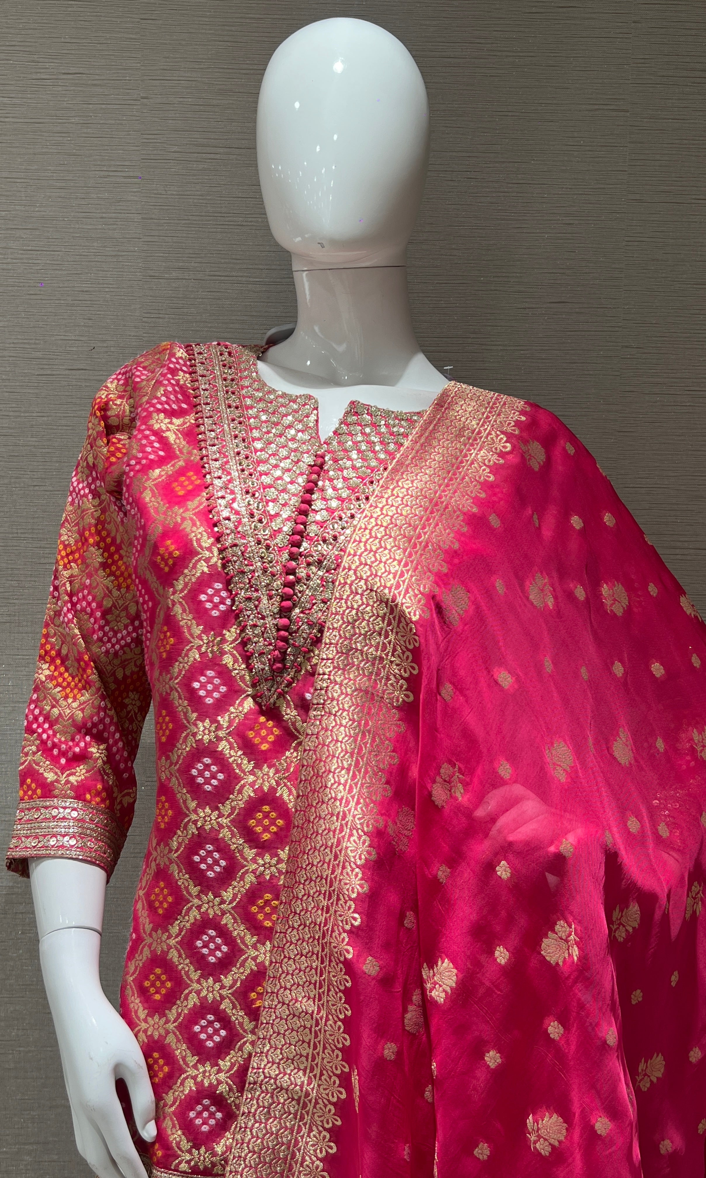 Pink embroidered sharara set with golden zari dupatta