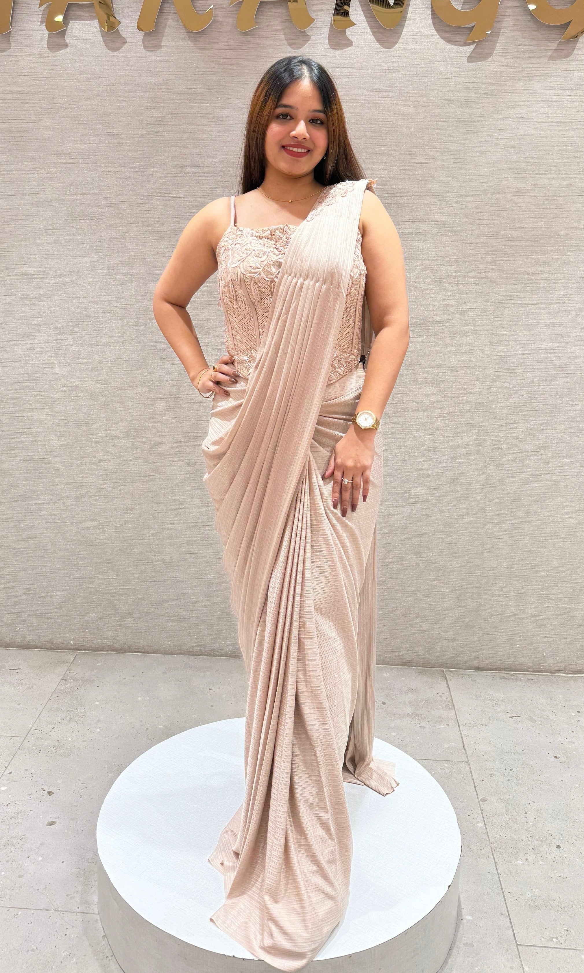 Beige drape saree with corset blouse