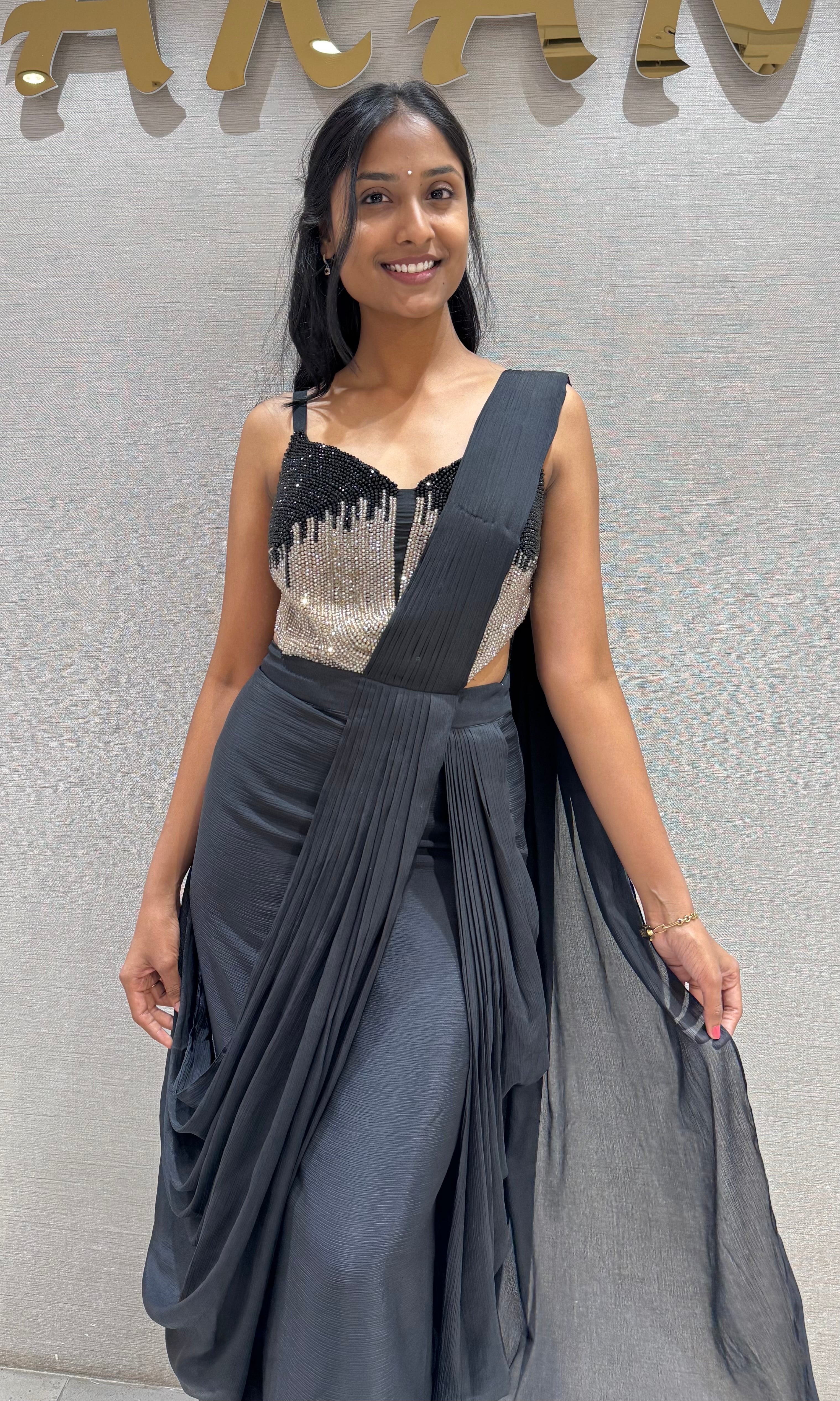 black draped saree with sequined corset blouse