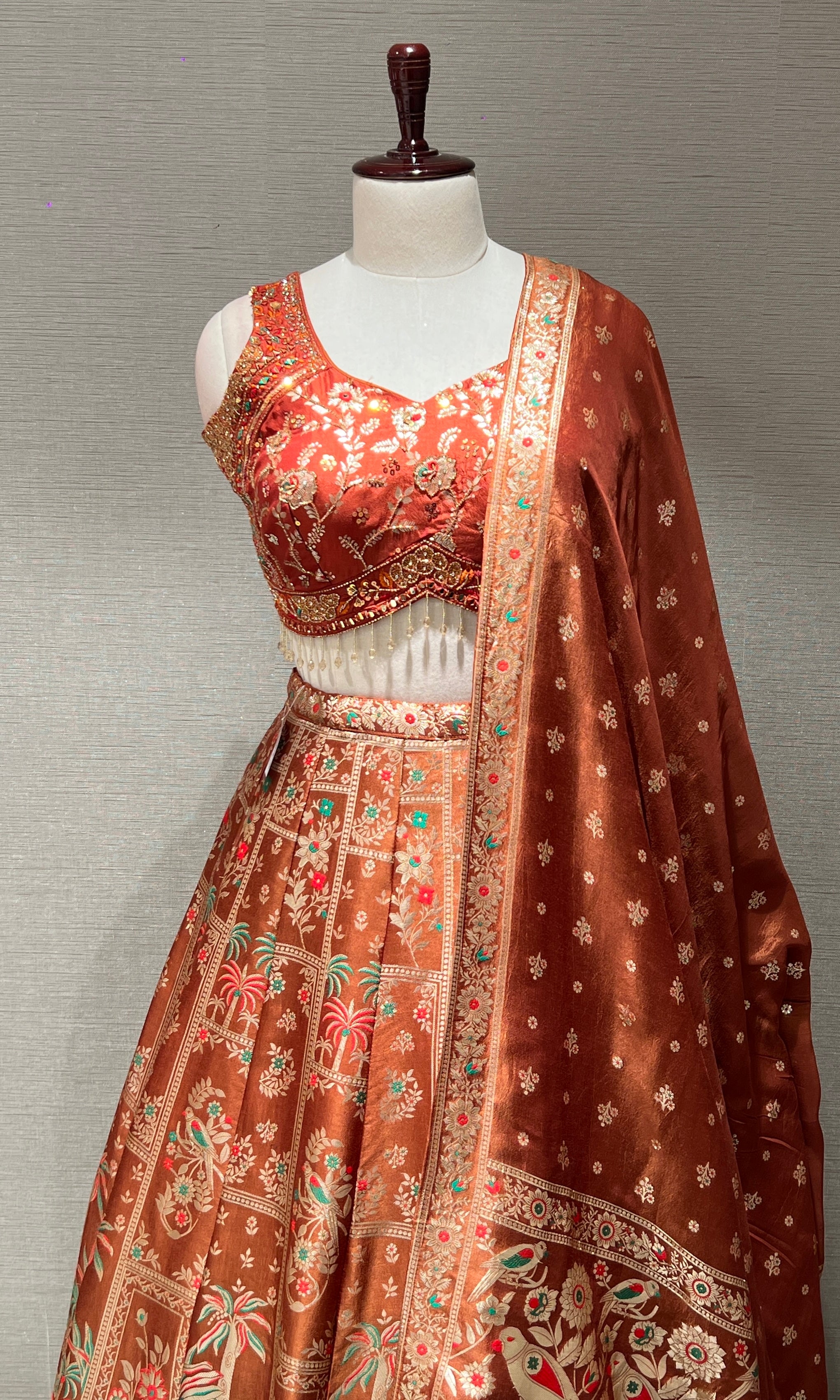 Rust orange Lehenga with Floral and Peacock embroidery