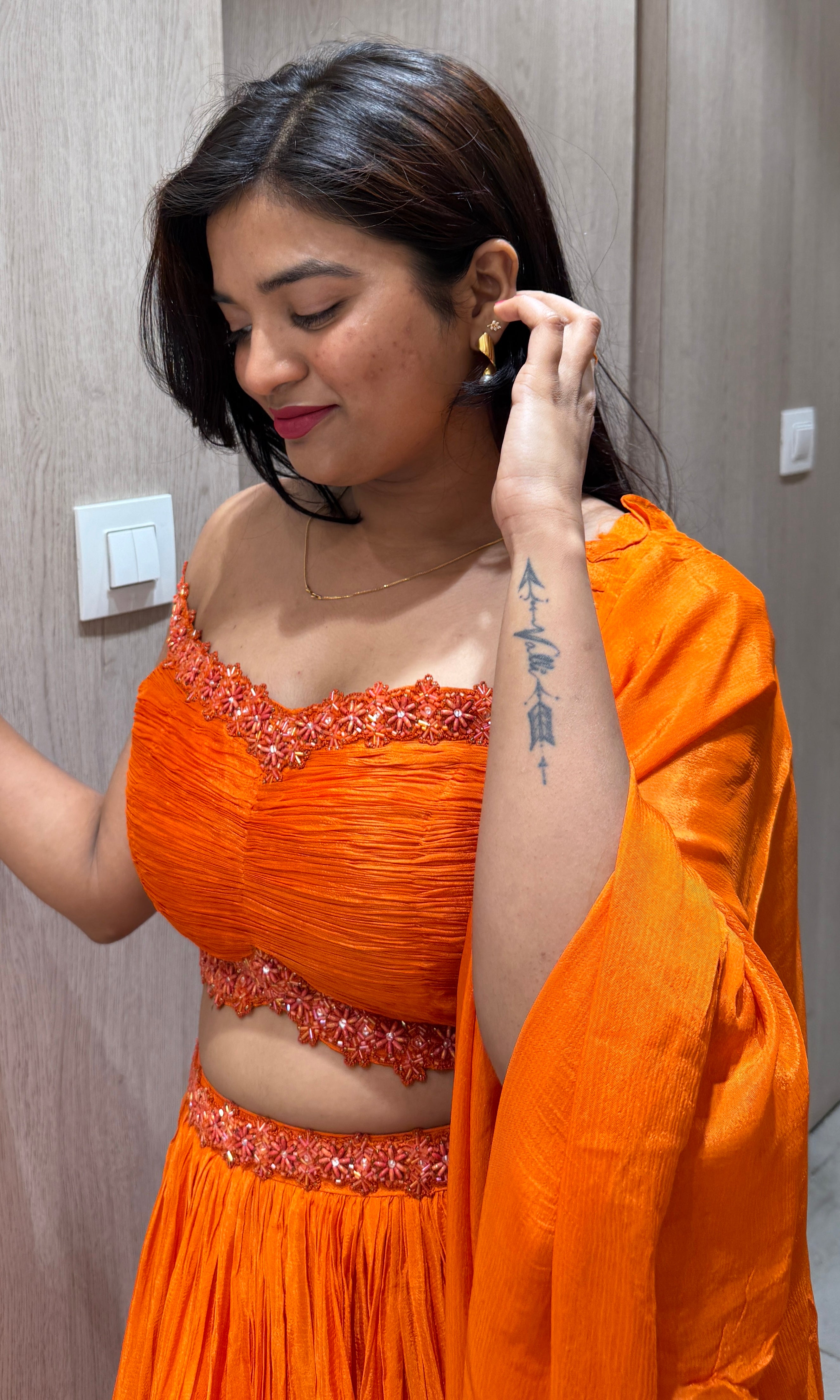 Orange lehenga with cold shoulder blouse 1000