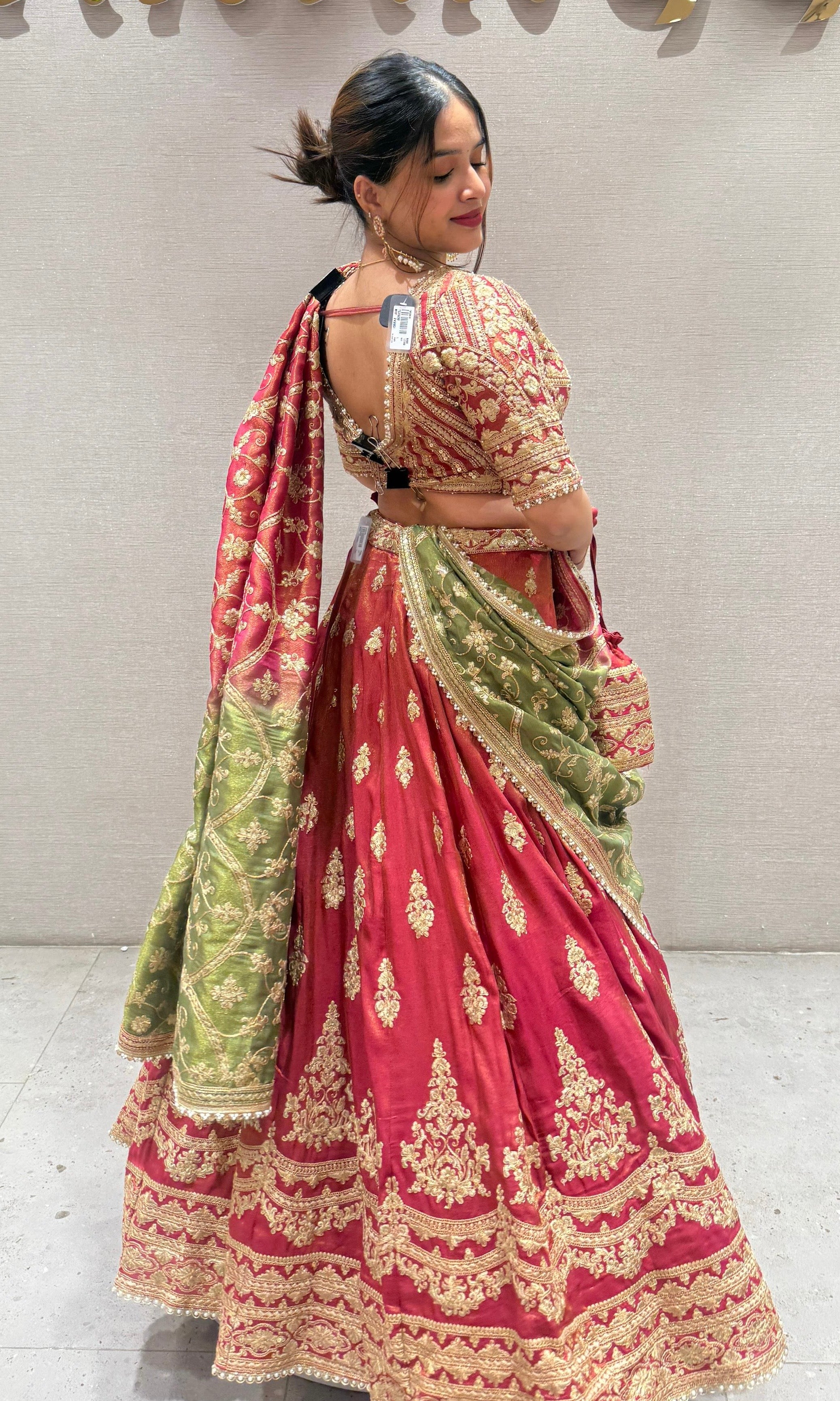 Brick red and green Lehenga with potli