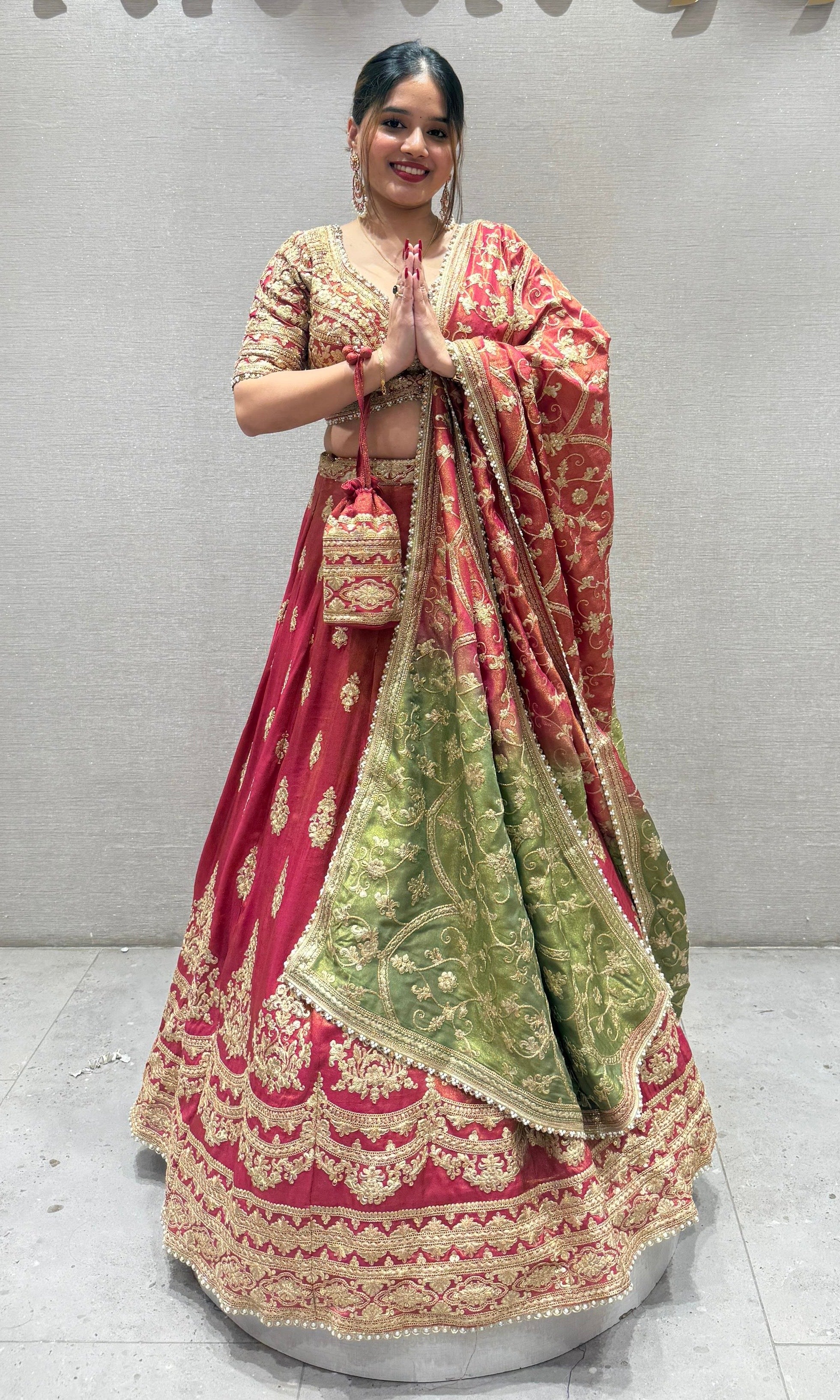 Brick red and green Lehenga with potli