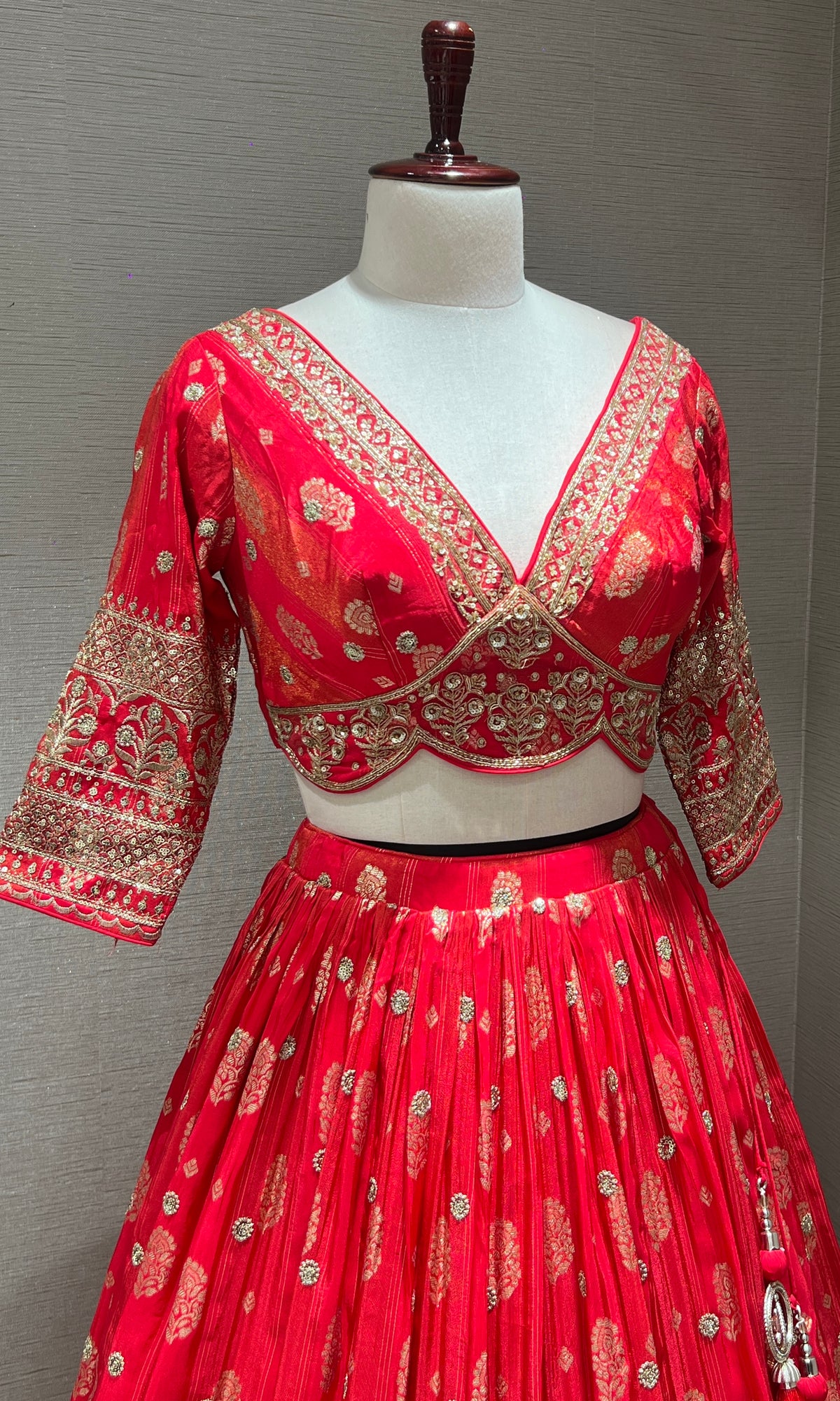 pink lehenga with intricate gold detailing