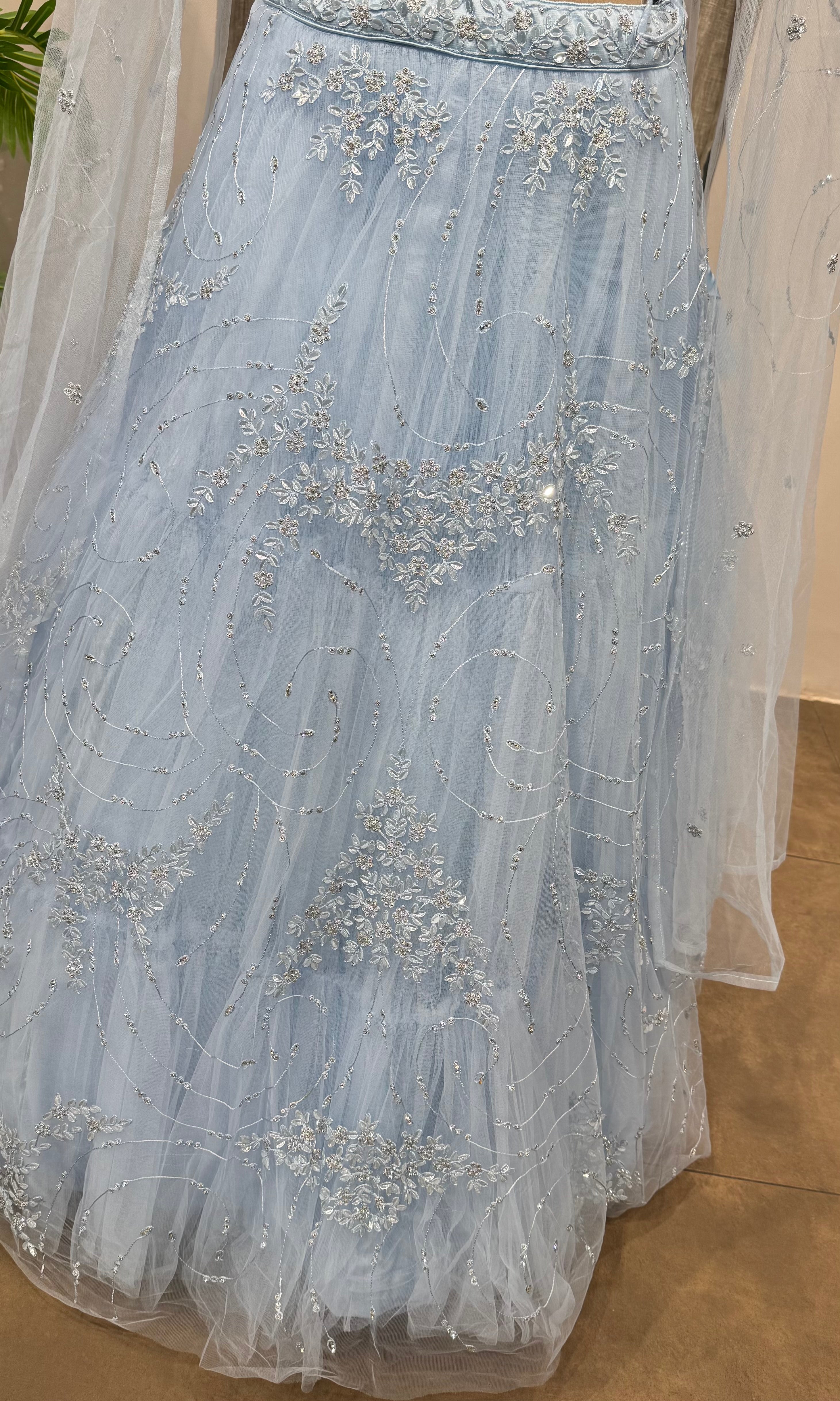 blue floral embroidered netted crop top lehenga